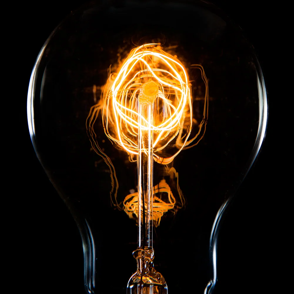 A light bulb generates light by first generating heat. Almost all incandescent light bulbs use filament coils made out of tungsten – a metal that has an abnormally high melting temperature. Electrical currents constantly flow from one end of the tun