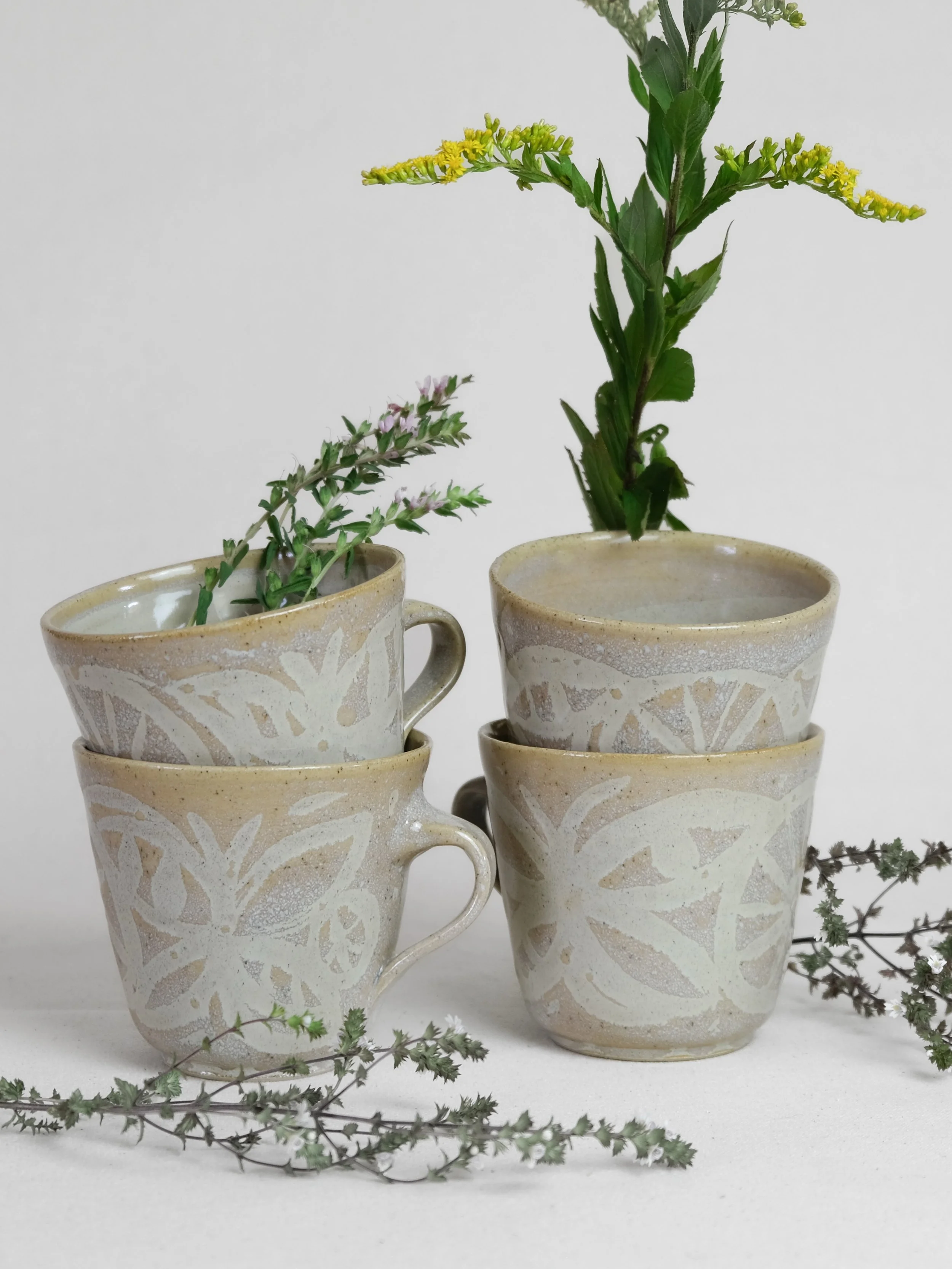 Butterfly Mugs ~~

Glazed beige stonware