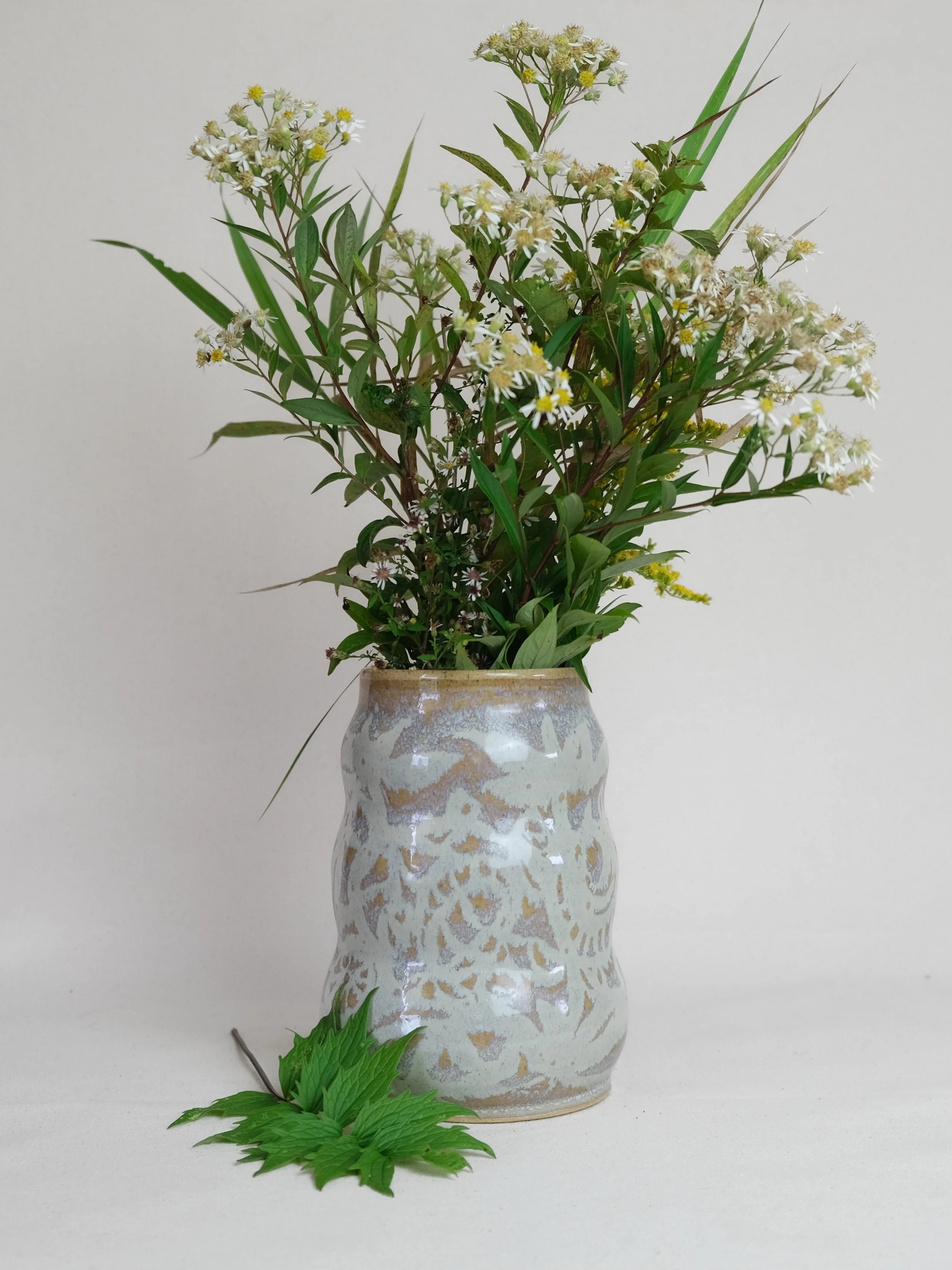 Yellow vase ~~

Beige stoneware with glaze &amp; wax resist drawing
