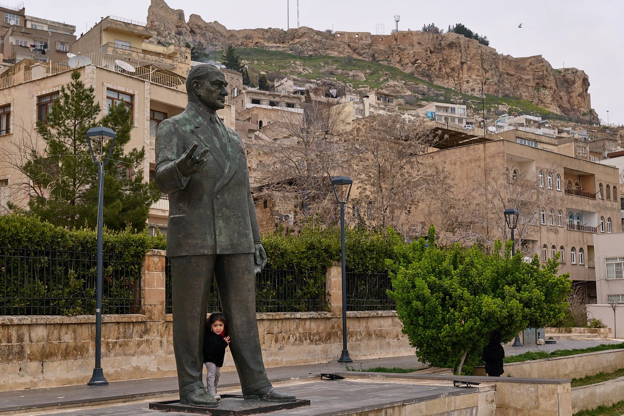    “How Zarok TV is Helping Preserve the Kurdish Language”     published in The Amargi.   A small child plays underneath a statue of Mustafa Kemal “Ataturk” (“Father of Turks”), in the predominantly Kurdish city of Mardin (Mêrdîn). Ataturk is seen by