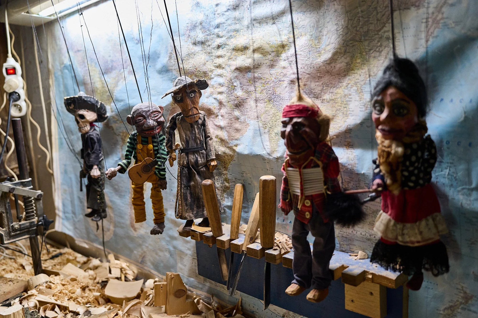  Some of the many puppets Martin has carved hanging on one of the walls of his studio, a mix of traditional and non-traditional Czech characters and charicatures.  