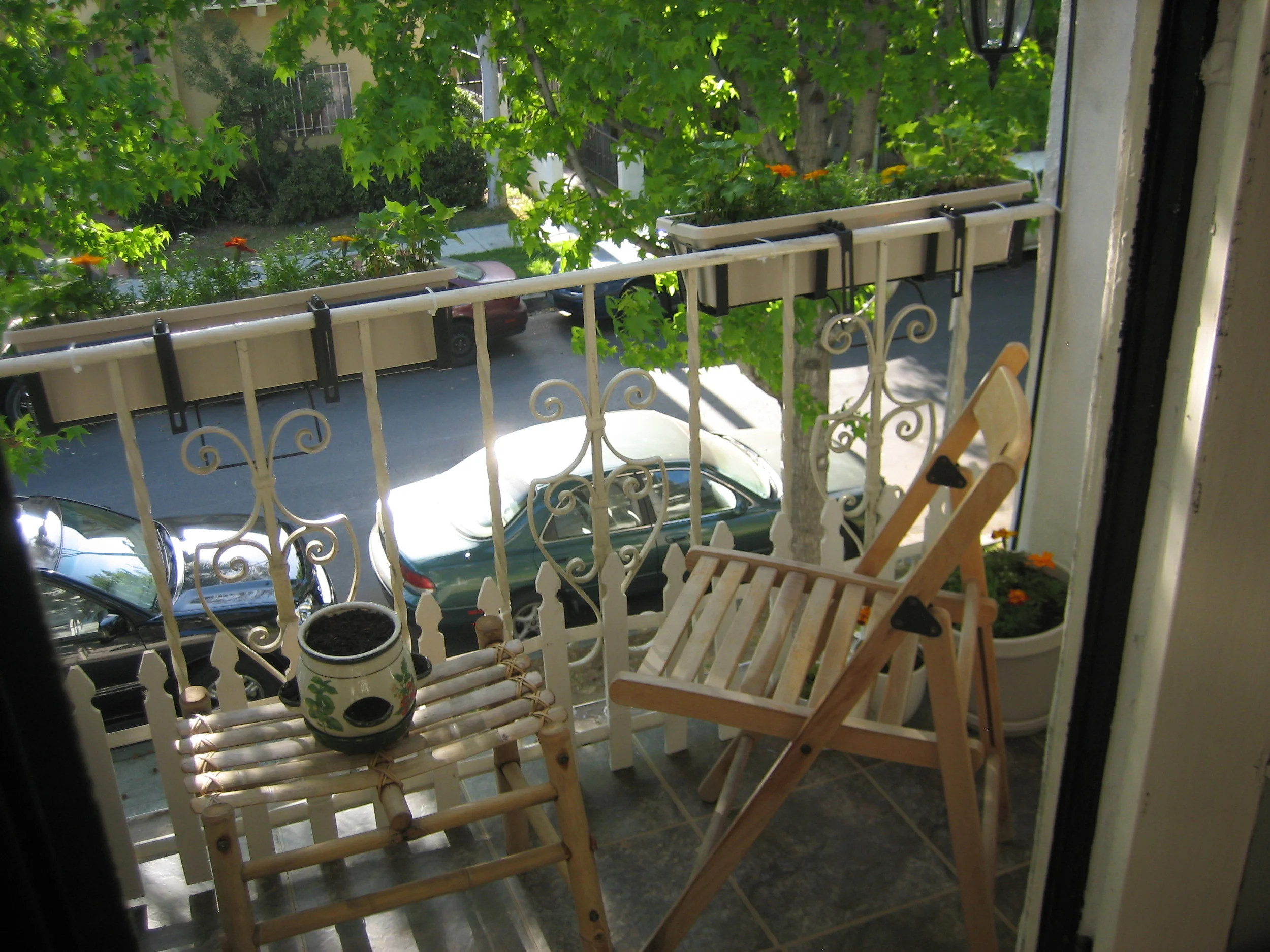  Shana installed new peel-and-stick floor tiles, and hung window boxes and solar lanterns to make the space cleaner, brighter, and more welcoming. 