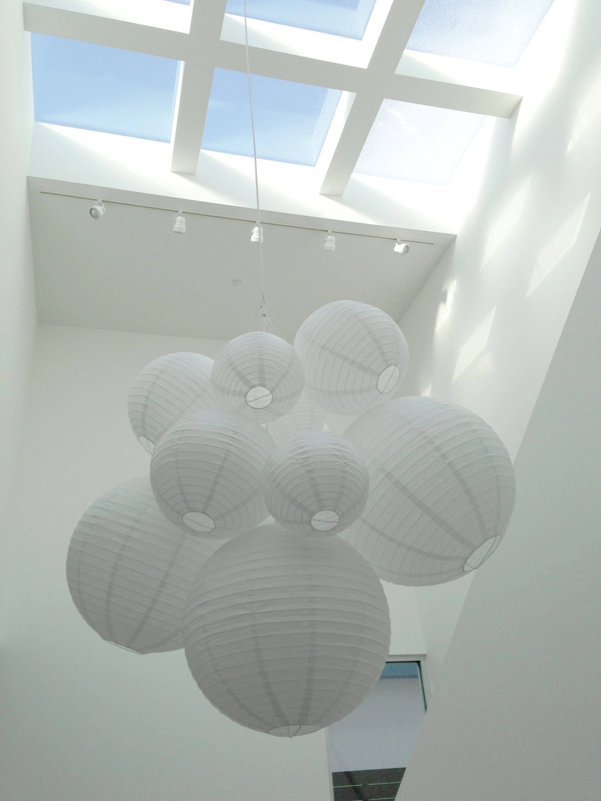  This custom paper lantern chandelier was personally made by Shana Cunningham for a spec house designed by  Dennis Gibbens Architects .  The finished fixture is like a sculpture; it looks different from every angle. 