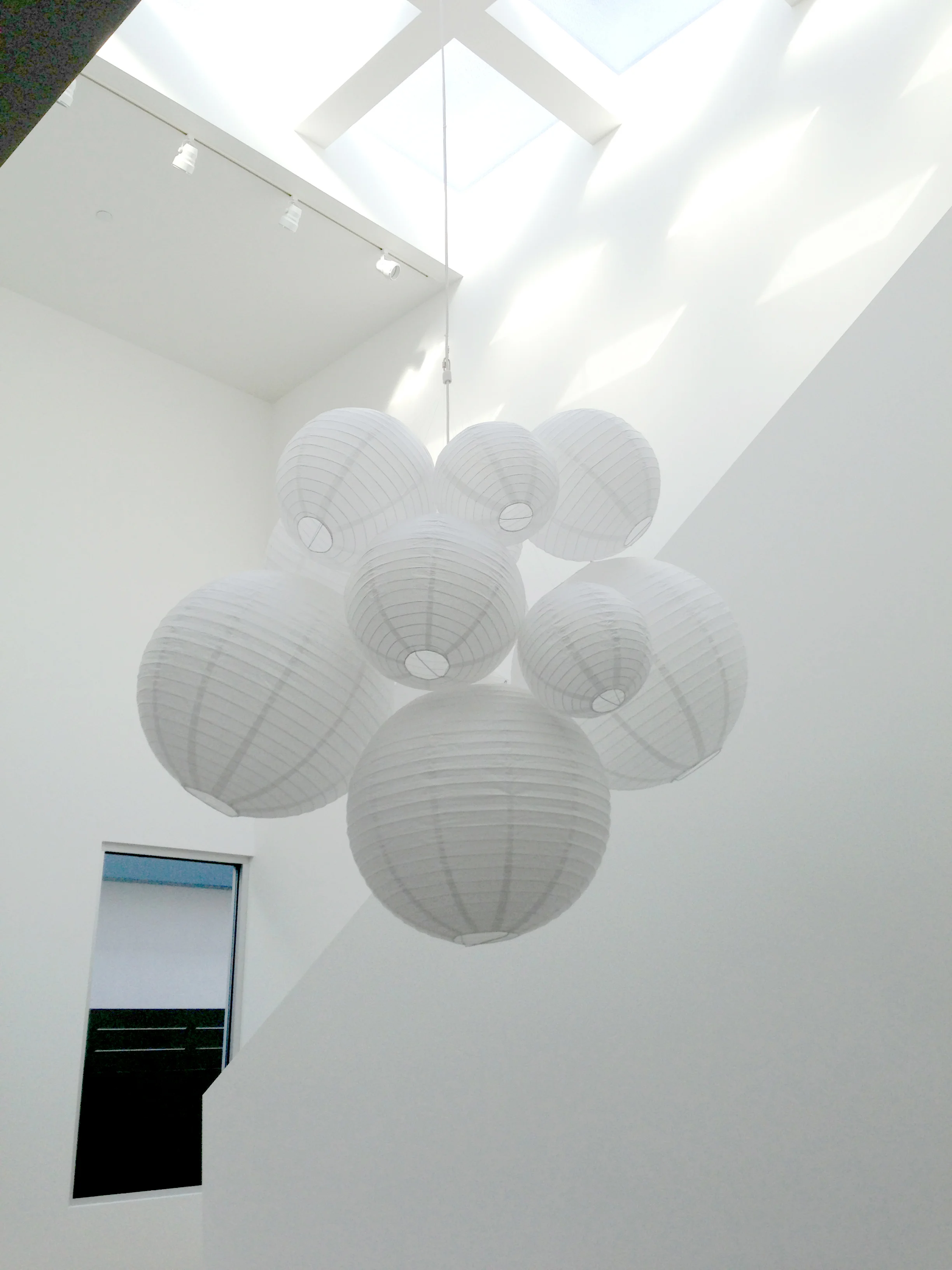  This custom paper lantern chandelier was personally made by Shana Cunningham for a spec house designed by  Dennis Gibbens Architects .  The finished fixture is like a sculpture; it looks different from every angle. 