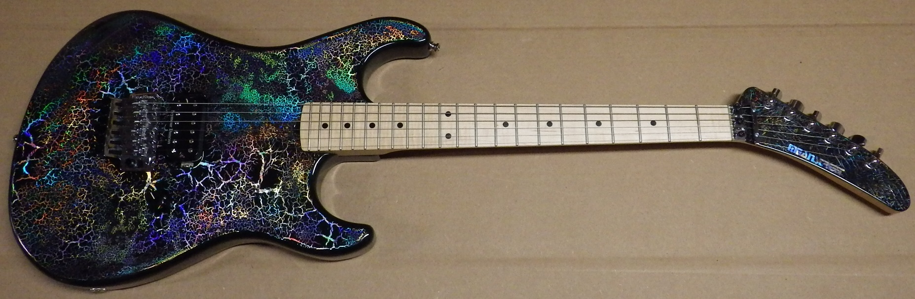 Mean Street Unchained Tour Model with wicked Holocrackle paint job and matching headstock, Poplar body, light flame 1 piece rock maple neck, R2 nut, 22 medium jumbo frets, Original Floyd Rose tremolo, Seymour Duncan TB14 Custom 5 pickup, Gotoh tuners, strap locks, CTS pot, Switchcraft jack...comes with Gator case. $1795 plus shipping SOLD