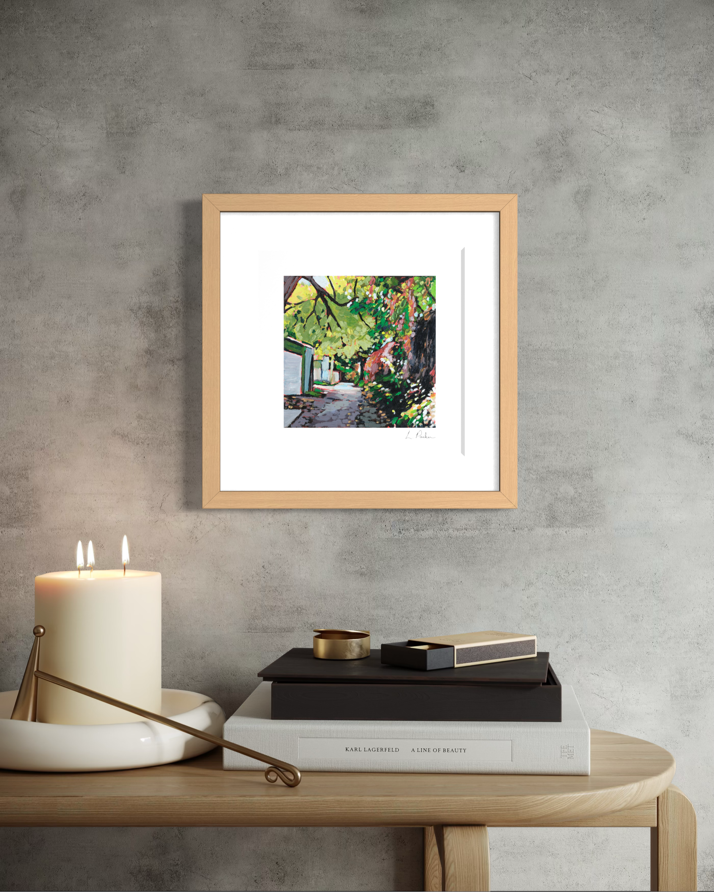 a leaf-covered Leslieville laneway fence — framed Toronto art print hanging on a wall above a record player