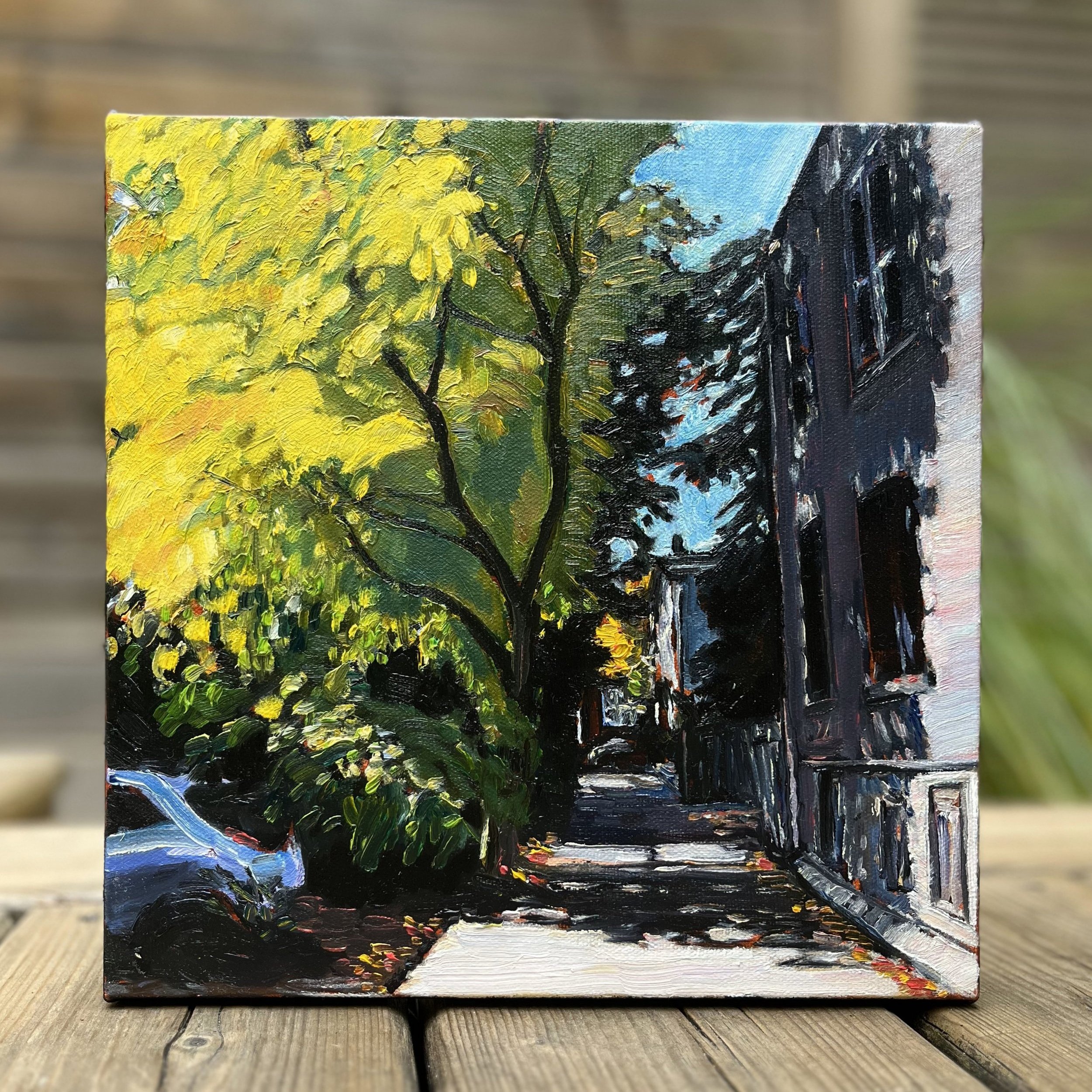 View Behind the Jackalope straight on—a compelling look at Leslie Parker’s intricate portrayal of Toronto’s hidden laneways, bathed in light and shadow.