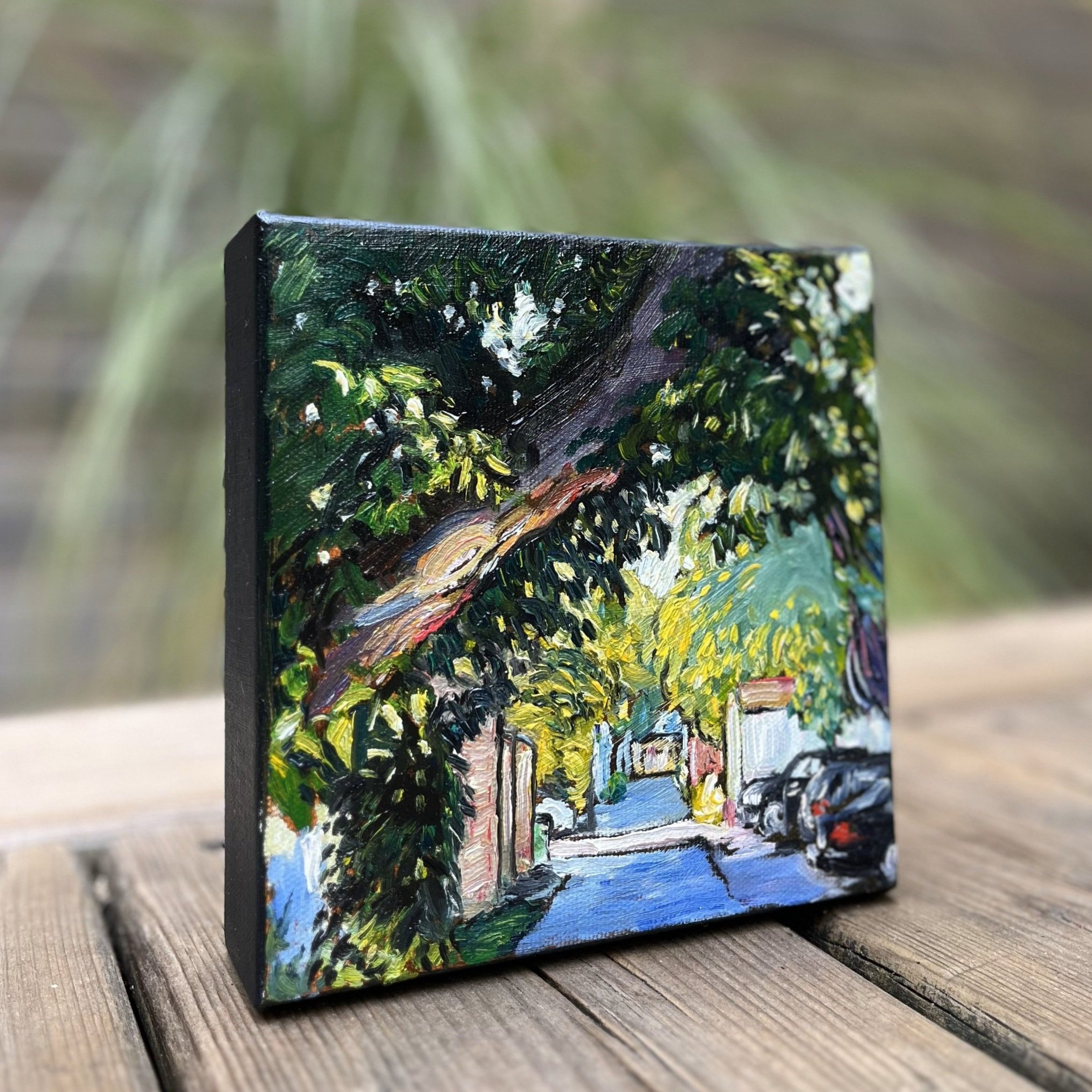 Side angle view of 'Half-Remembered Street' – See the textured depth and vivid color play from every angle in this original 6"x6" oil painting, designed to draw you into a hidden urban scene.