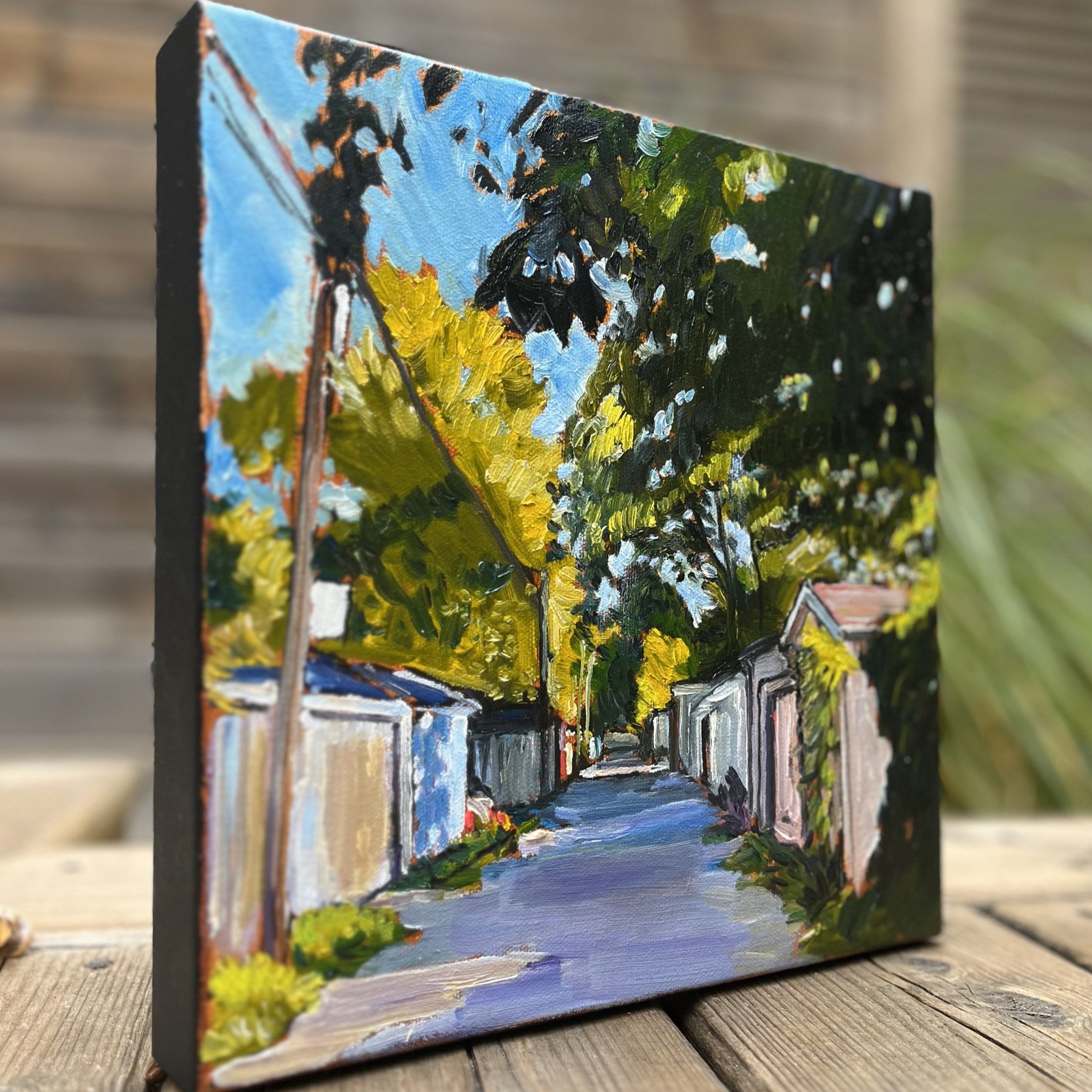 "Hidden City" at an Angle - Get a closer look at the texture and depth of this original 10"x10" oil painting, showcasing every brushstroke of Toronto’s secluded urban pathways.