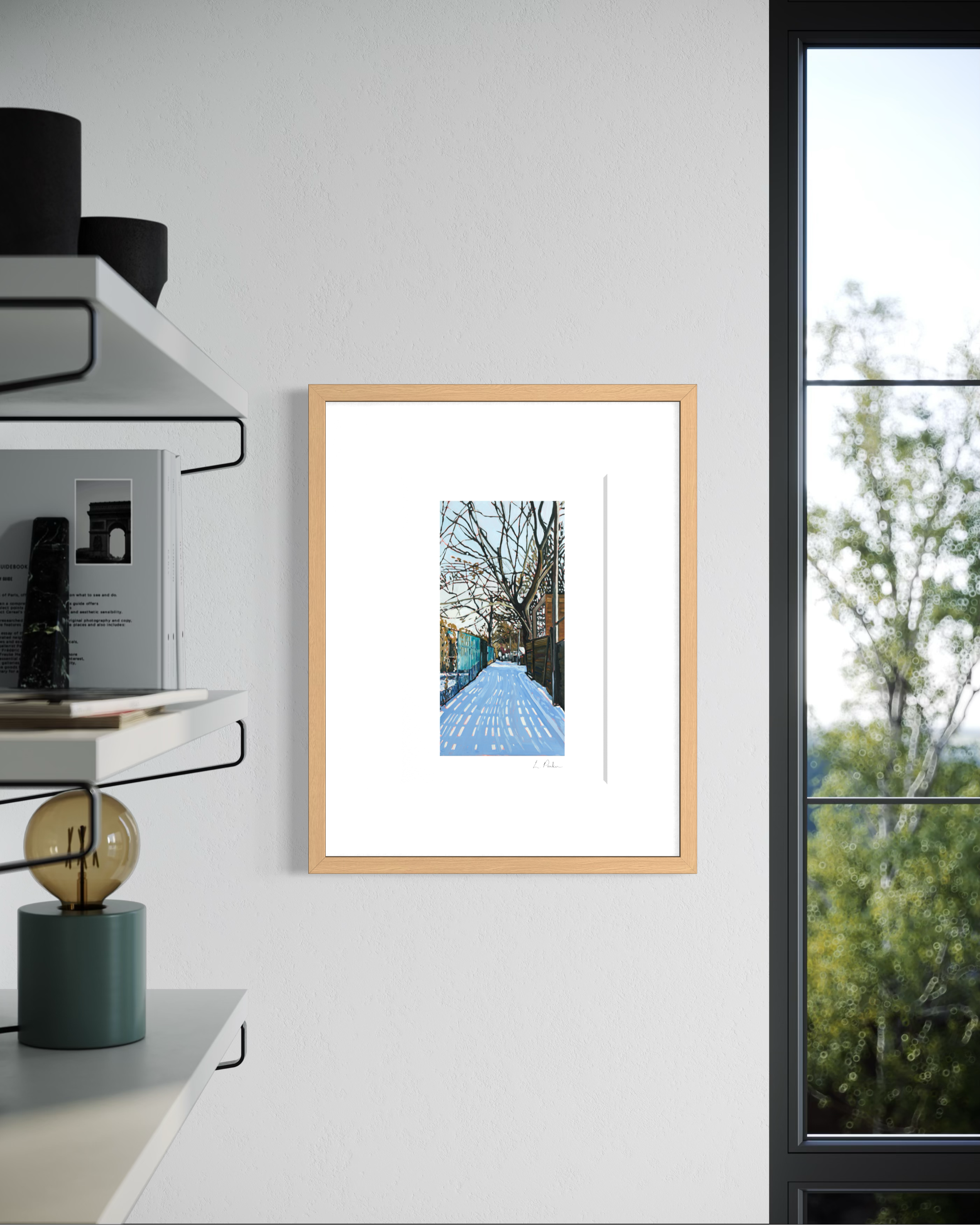 a fence shadow across the snow — framed Toronto art print hanging on a wall next to a window in a modernist house