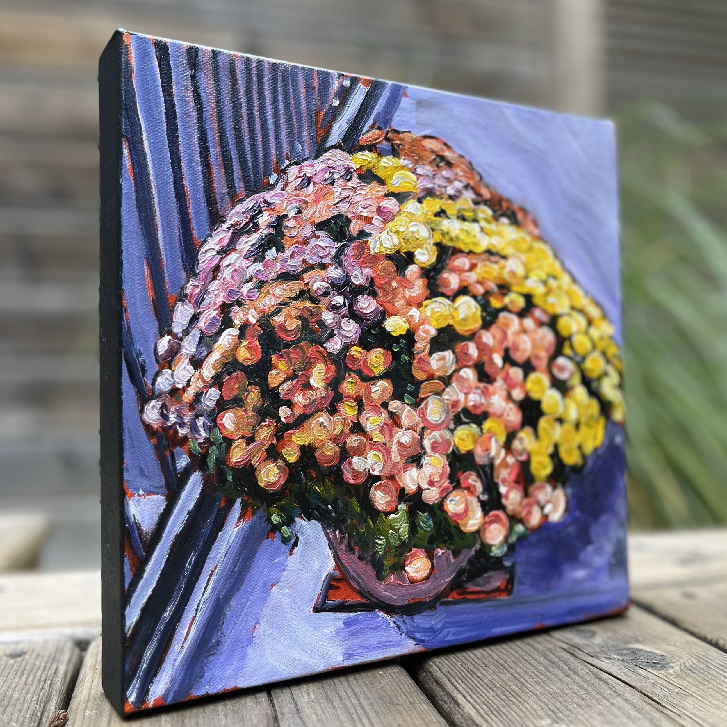 Side view of All the Colours, All at Once: the textured brushstrokes and layered colors in this original 6x6 oil painting bring dimension and vibrancy from every angle.