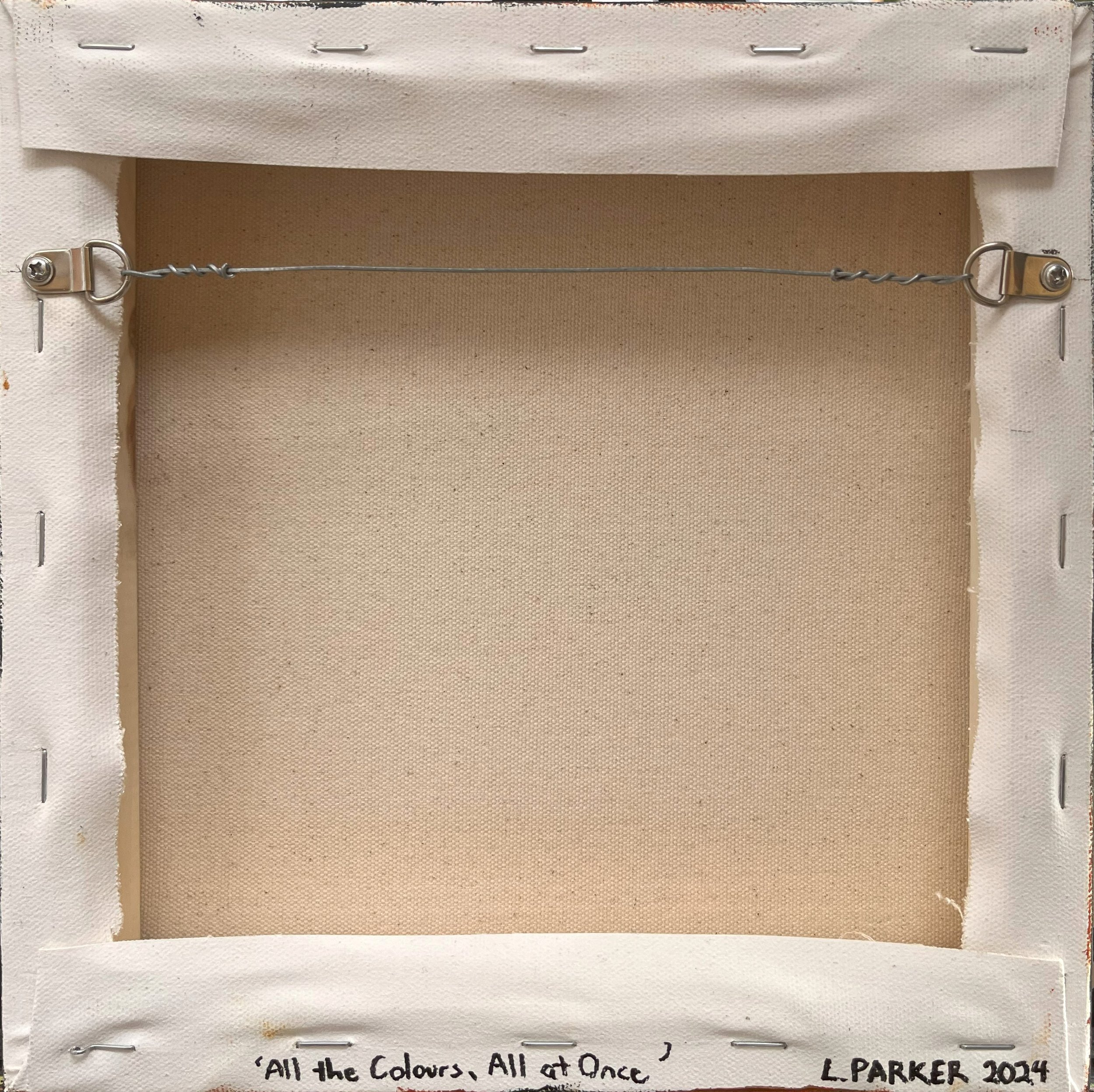 Back view of All the Colours, All at Once: gallery-wrapped 6x6 canvas, wired and ready to hang, showcasing the craftsmanship and care in this original piece.