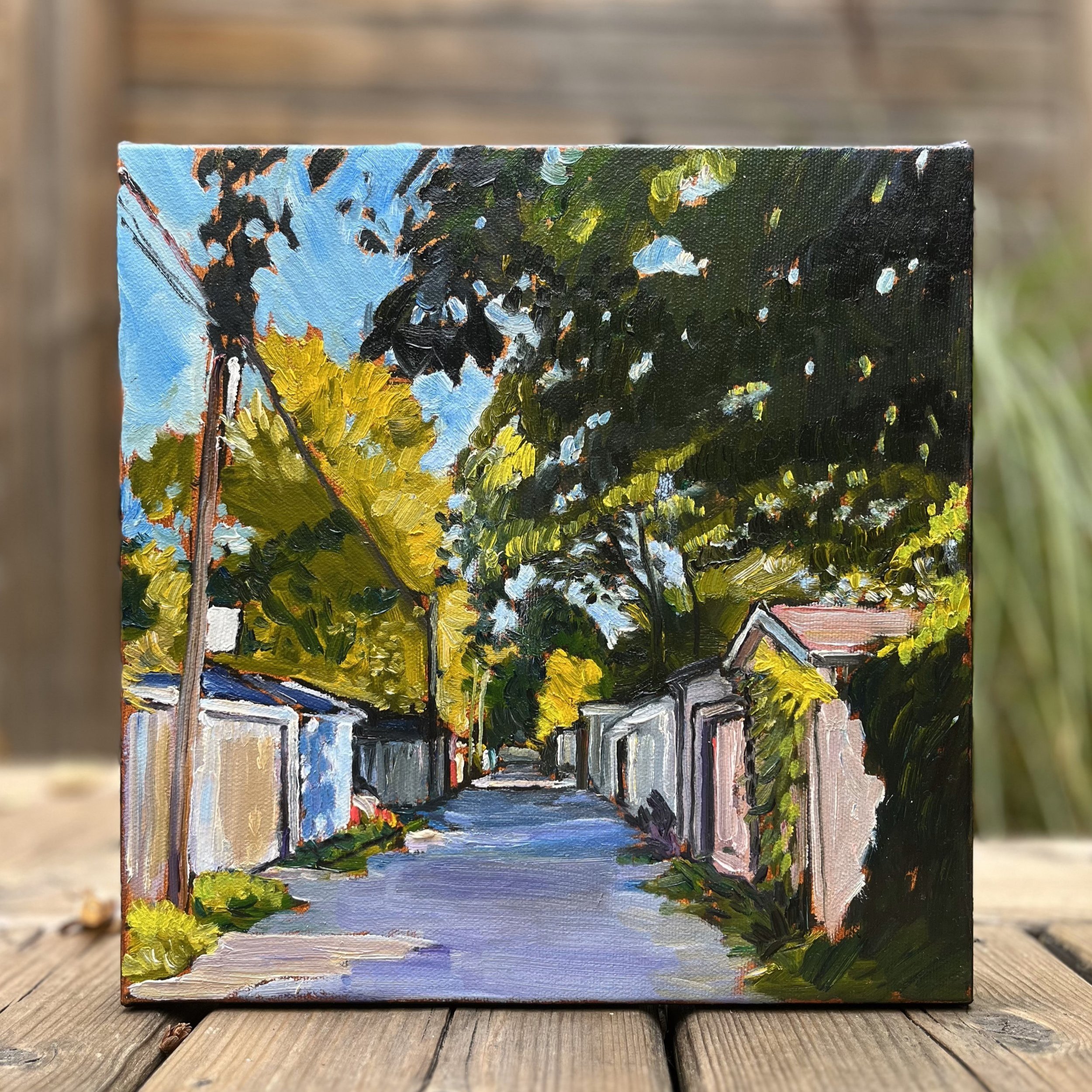 "Hidden City" Front View - The full face of this 10"x10" oil on canvas reveals a detailed scene of Toronto's hidden laneways, capturing a quiet beauty often overlooked