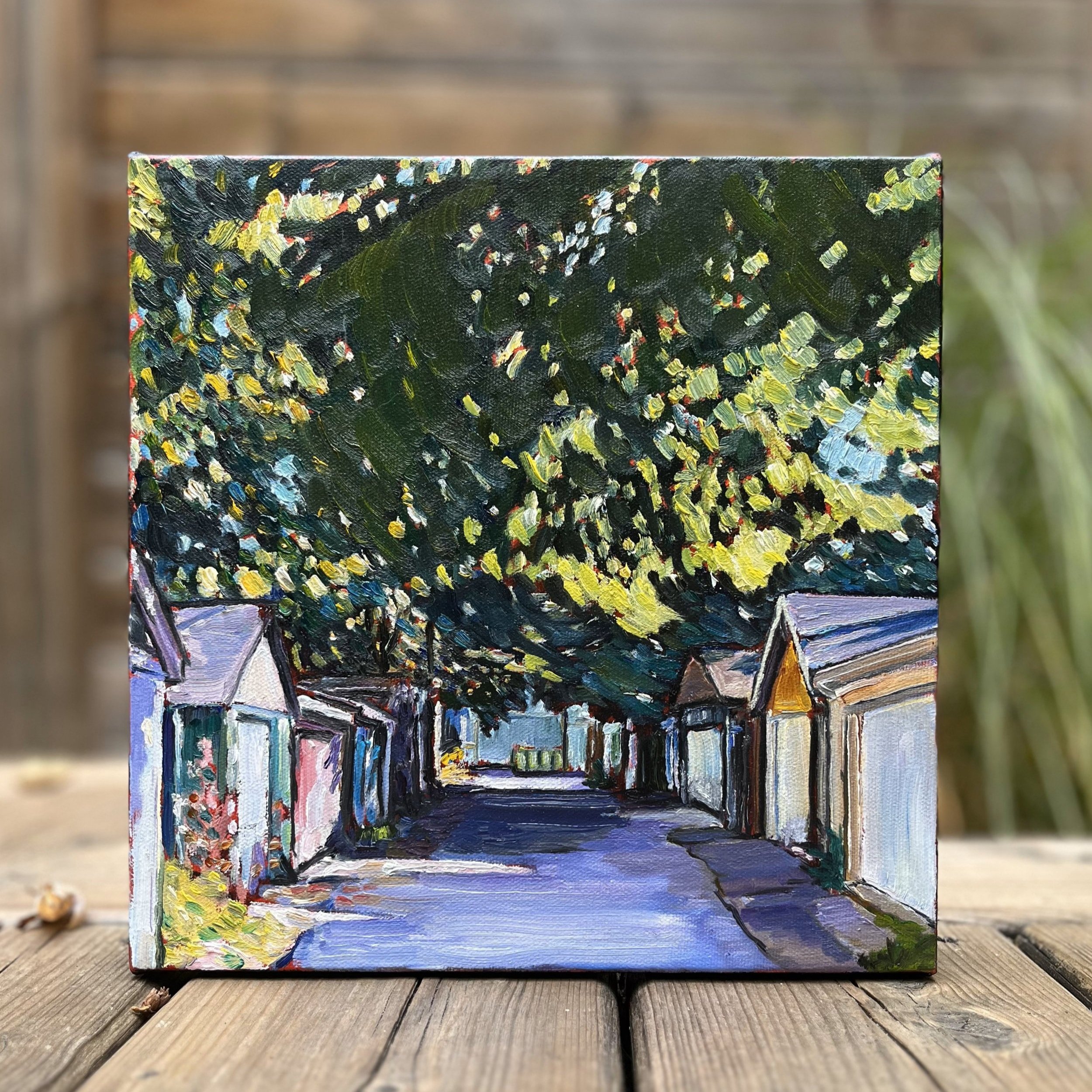 The Space Between - A full, straight-on view of Leslie Parker's 10"x10" oil painting, highlighting its intricate colors and tranquil scene of an urban laneway.