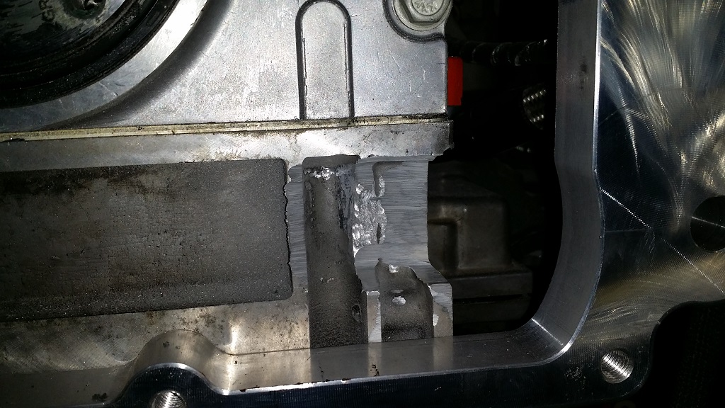 Beginning grinding done on an LS block needed for clearance. Note location of the area relative to the adapter. More cleanup grinding is needed at this stage.
