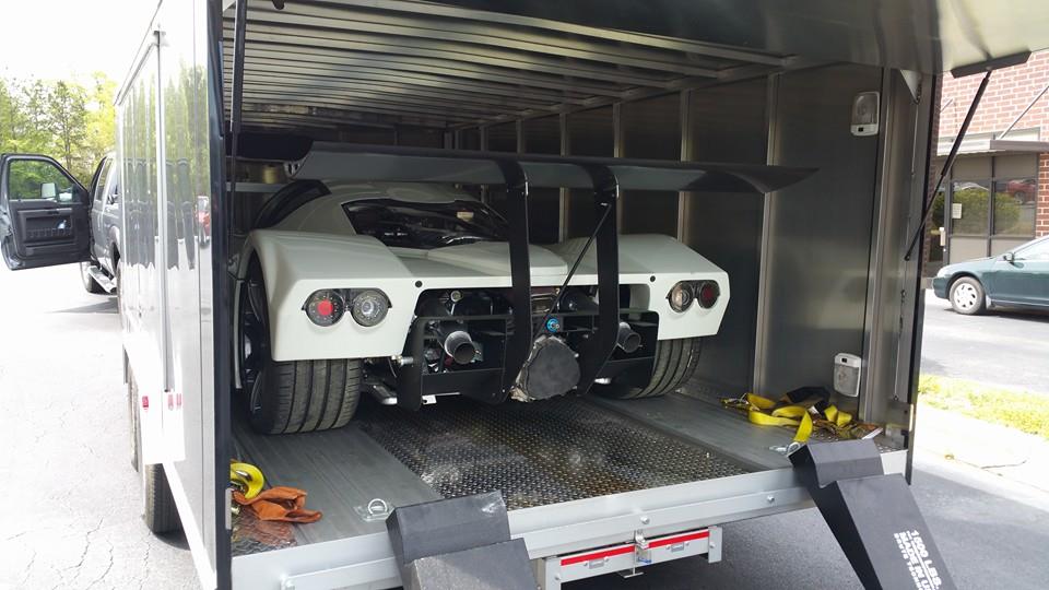 A finished car being transported, but similar to a new kit- you have to get it in and out of the trailer carefully!