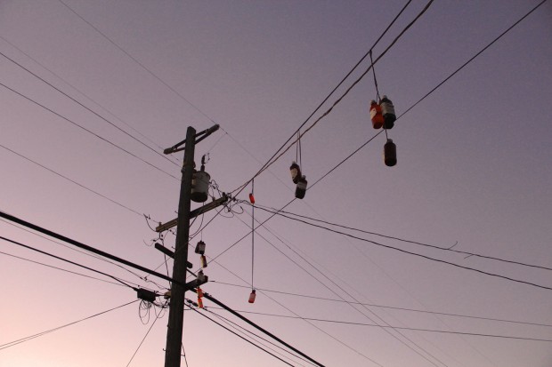 Bottles of cough syrup hang from power lines in Central Richmond. They are both a signal that hits of codeine can be found here and also a testament to the growing presence of abused prescription drugs on the streets of Richmond. PHOTO: Julie Brown