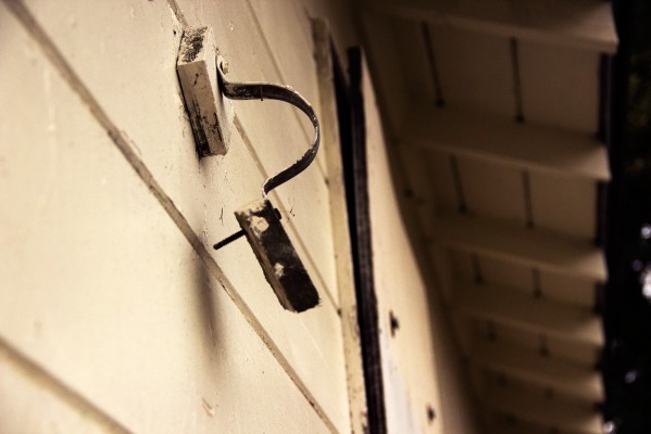 Where there once was an aluminum gutter now rests a lonely hinge. Scrap metal thieves have picked over this property in Central Richmond. PHOTO: Julie Brown