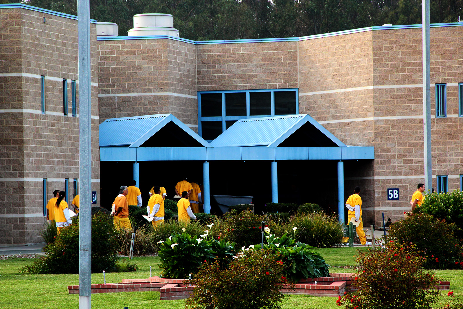 Inmates walk in line around the West County jail's yard. PHOTO: Rachel Witte