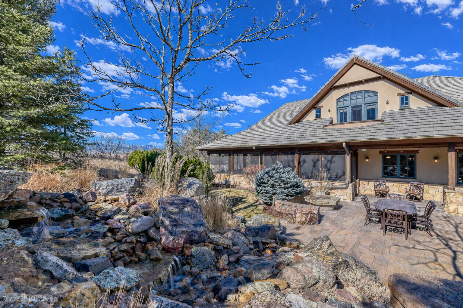 Serene suburban home with water features.png