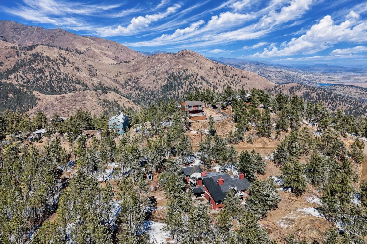 Mountain homes surrounded by pine trees.jpg