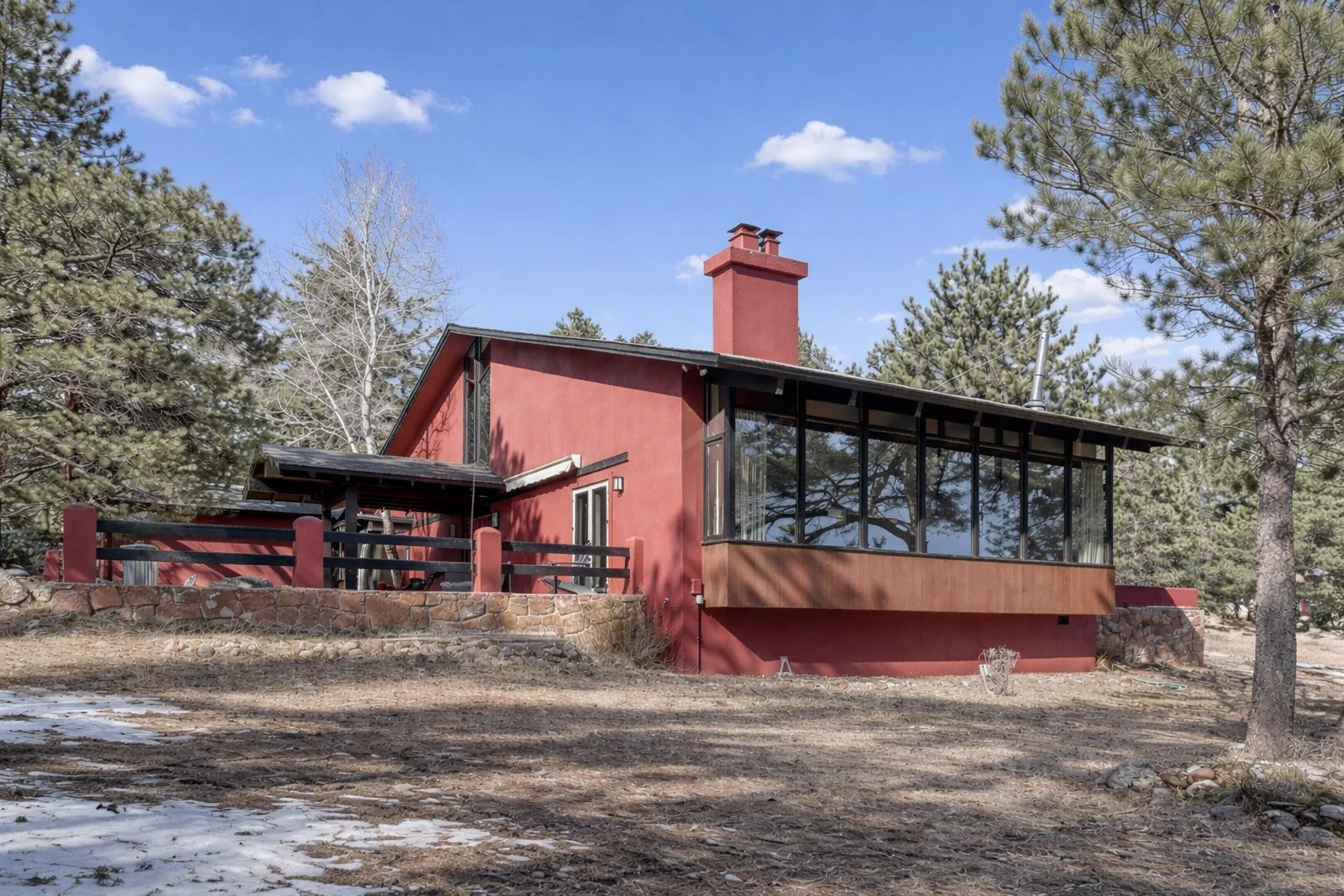 Red house in a woodland setting.jpg