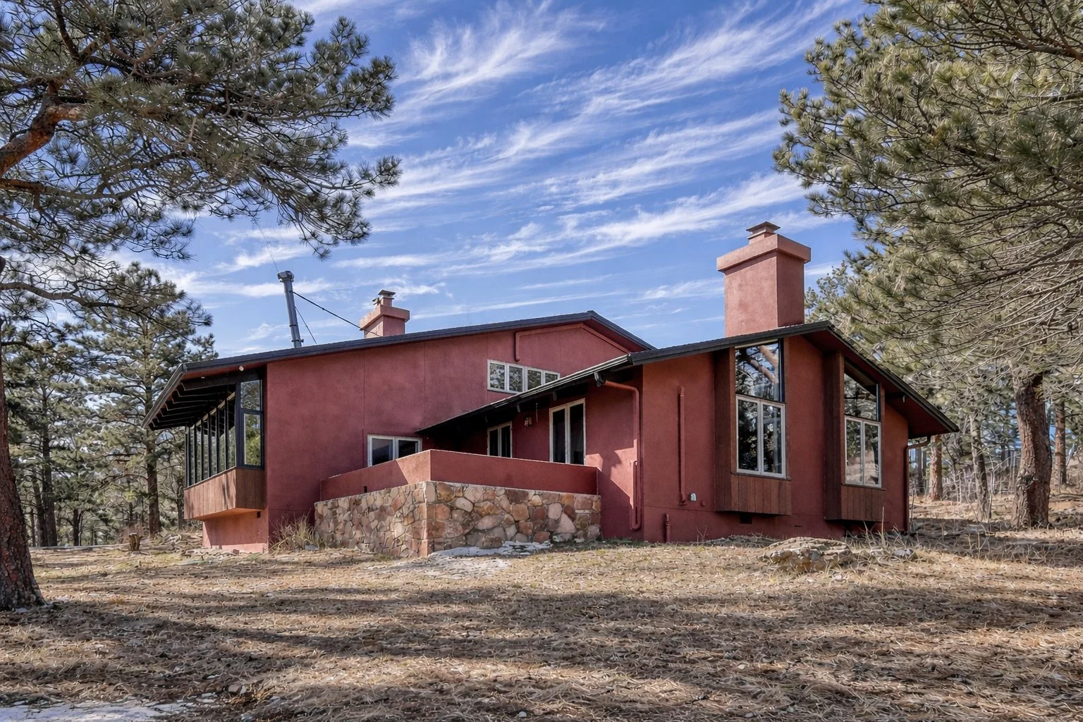 Red mountain home in the forest.jpg