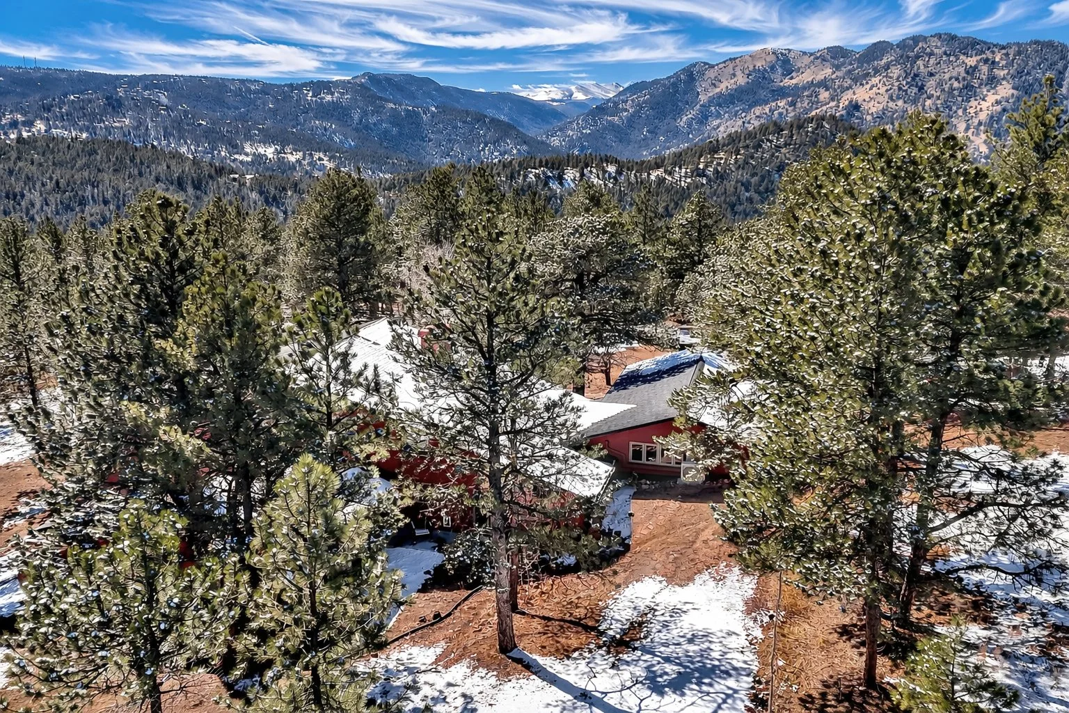 Snowy mountain cabin in winter forest.jpg