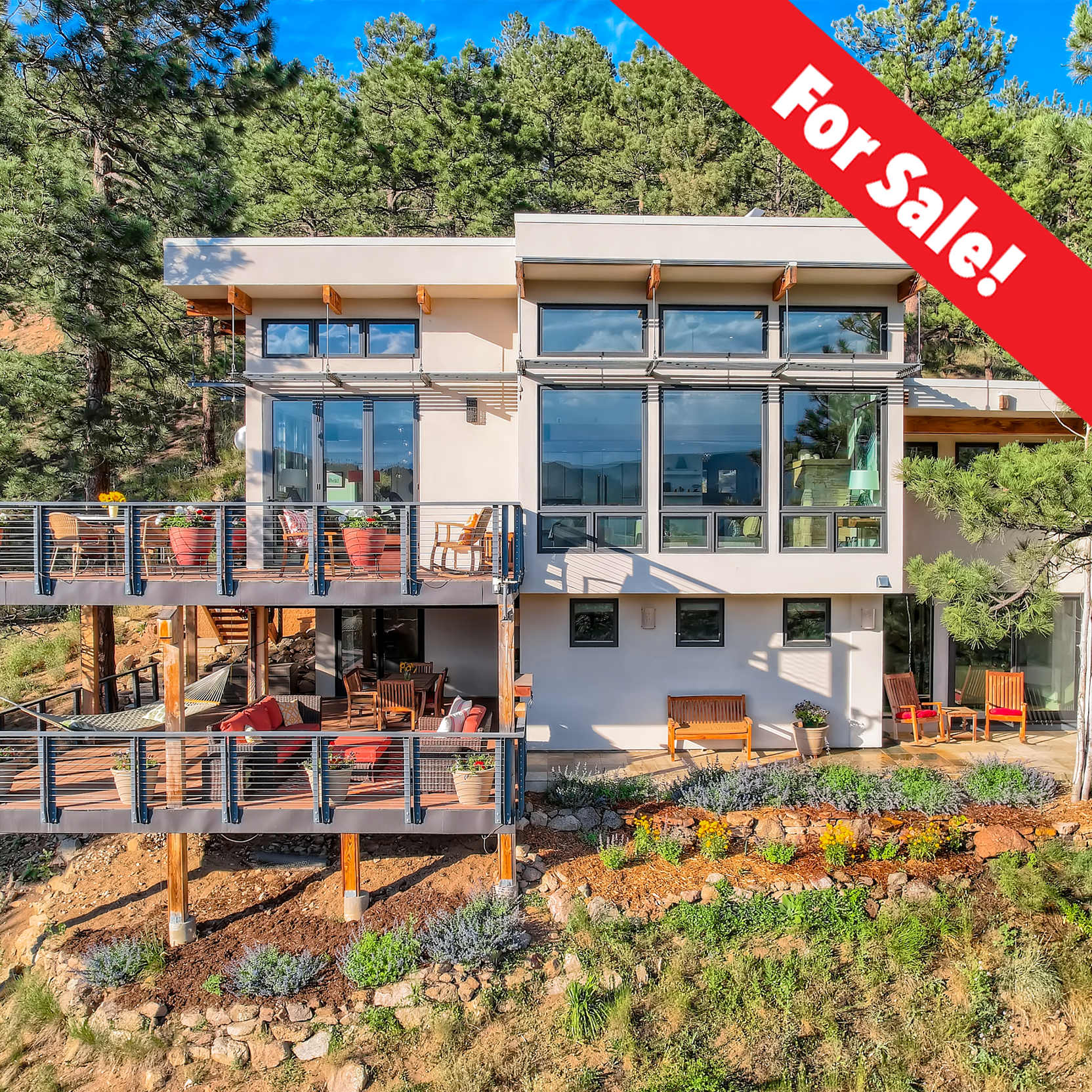  A sunny and serene modern mountain retreat set along the edge of close-in Sunshine Canyon on nearly three private acres off quiet Poorman Road. Just minutes to town, yet worlds away, with easy access to Sanitas, Lion’s Lair, and Bald Mountain trails