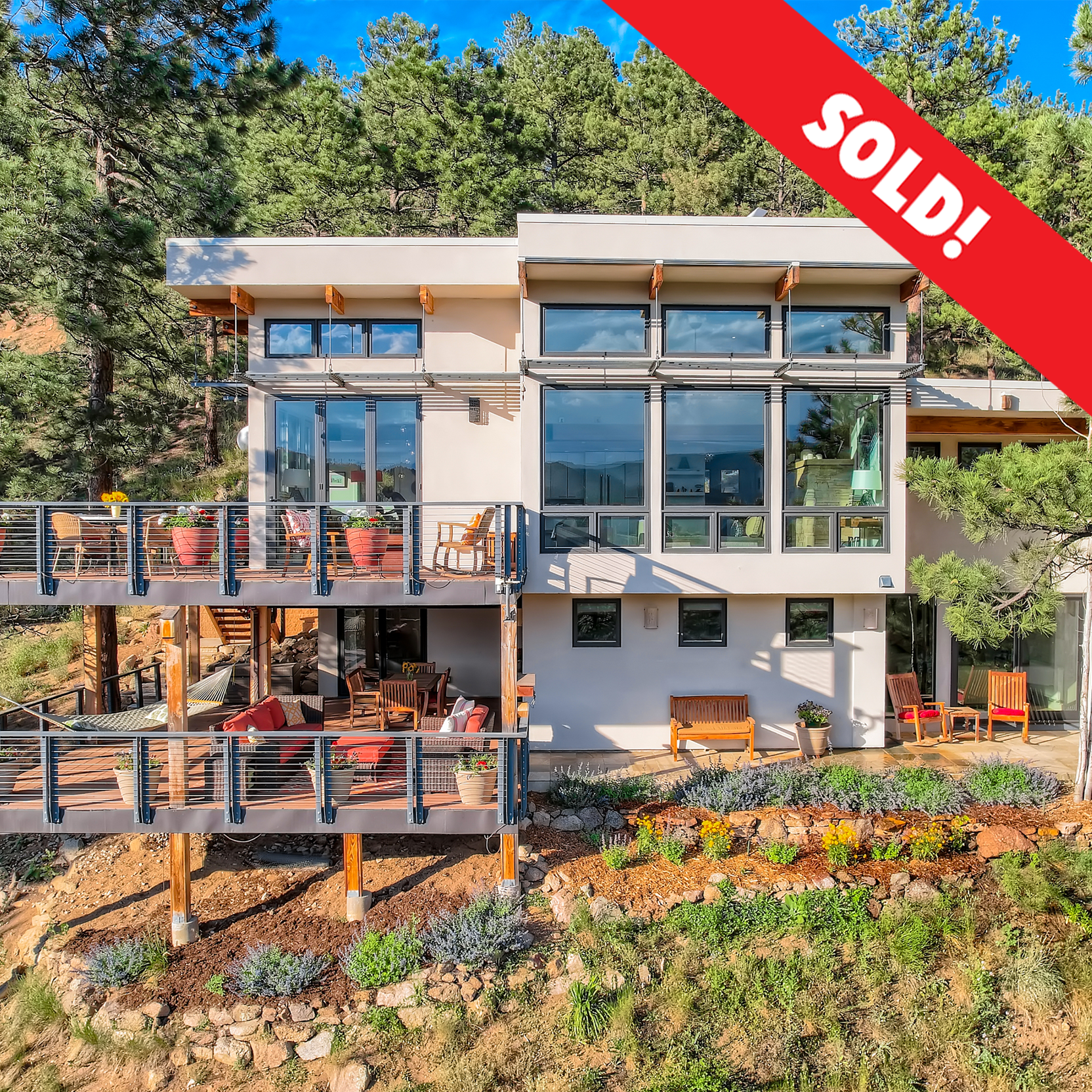  A sunny and serene modern mountain retreat set along the edge of close-in Sunshine Canyon on nearly three private acres off quiet Poorman Road. Just minutes to town, yet worlds away, with easy access to Sanitas, Lion’s Lair, and Bald Mountain trails