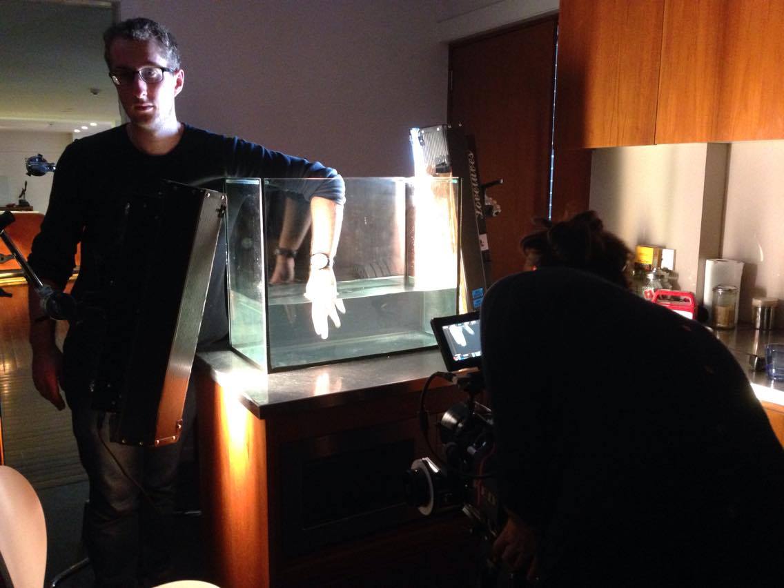 My assistant Ben 'stands-in' while I line up the shot with the Dragon and 75mm Cooke S4. (2) mini fluorescents keep him warm. © Katie Macqueen