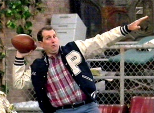 al-bundy-in-polk-high-letterman-jacket-with-football-jpg.jpg