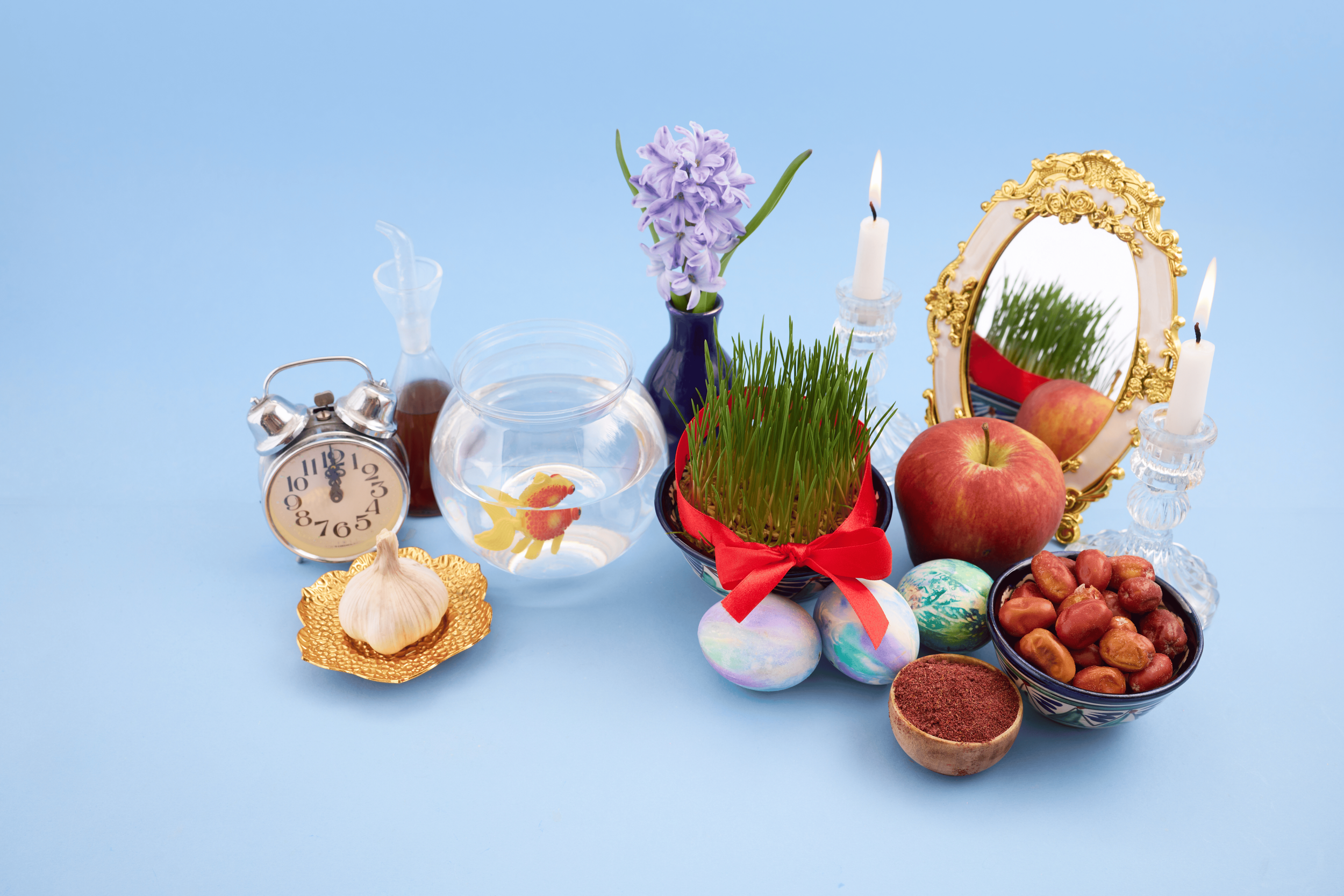 Traditional Nowruz haft-sin table with seven symbolic items celebrating Persian New Year during the Spring Equinox