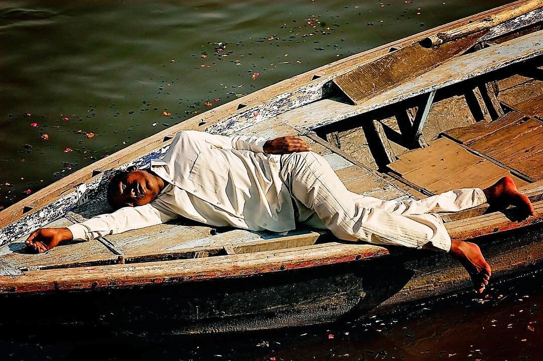 Asleep in the afternoon light on The Holy Ganga. #lifeinlight #indiatravelgram #india #style #color #nationaldestinations #instagram #_soi #storiesofindia #photooftheday #passionpassport #travel #travelgram #portrait #documentaryphotography #travelph