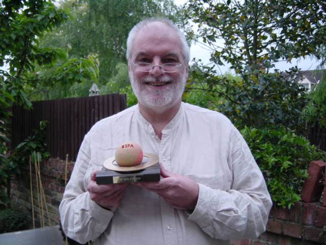  PK with BSFA Non-Fiction Award, 2011. Photo by Maureen Kincaid Speller 