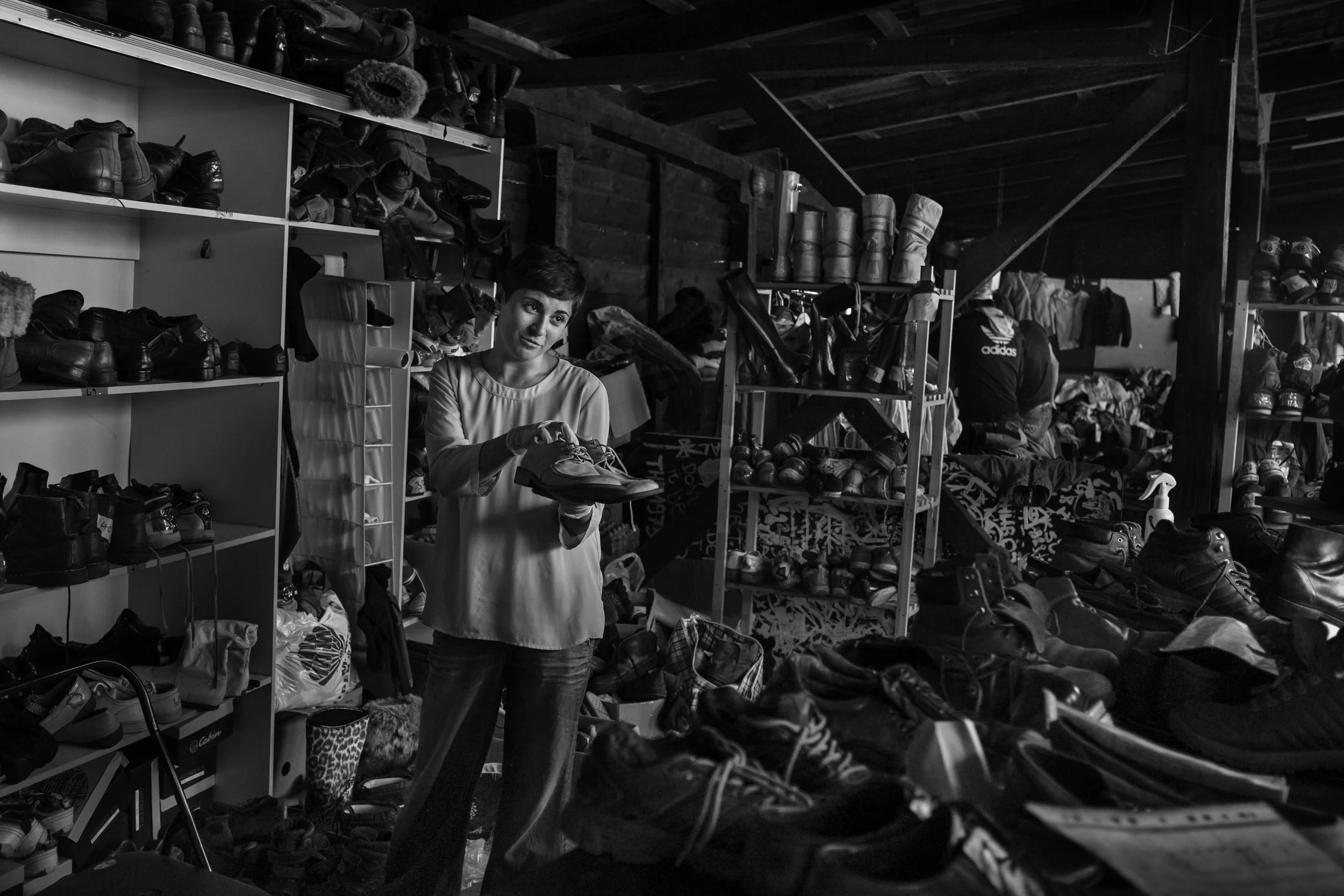 An Italian volunteer handed out shoes at a refugee center in Belgrade. 