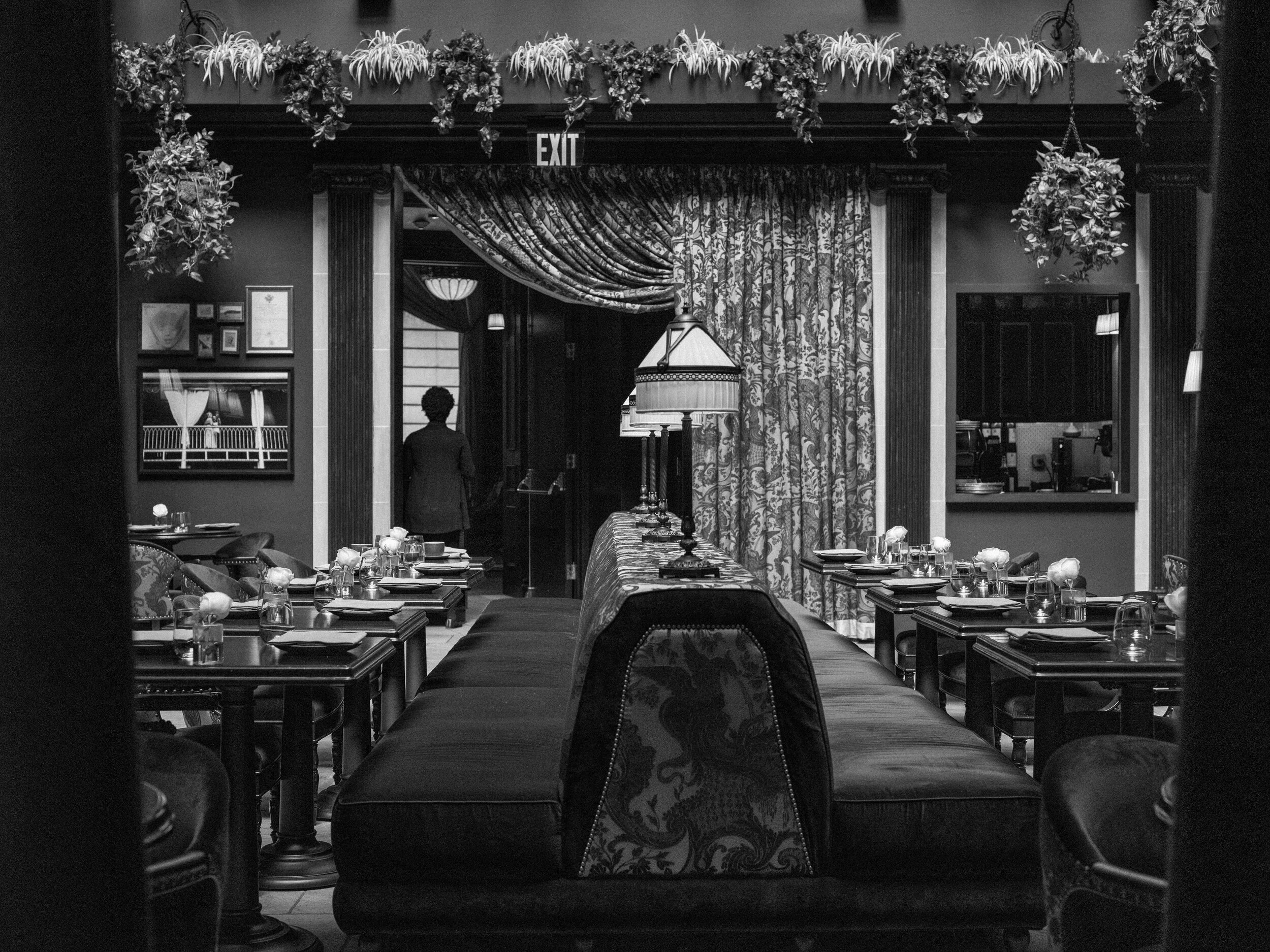  An empty restaurant at the Nomad Hotel in Chelsea, Manhattan. The hotel would close down entirely and board up the doors and windows to prevent looting. 