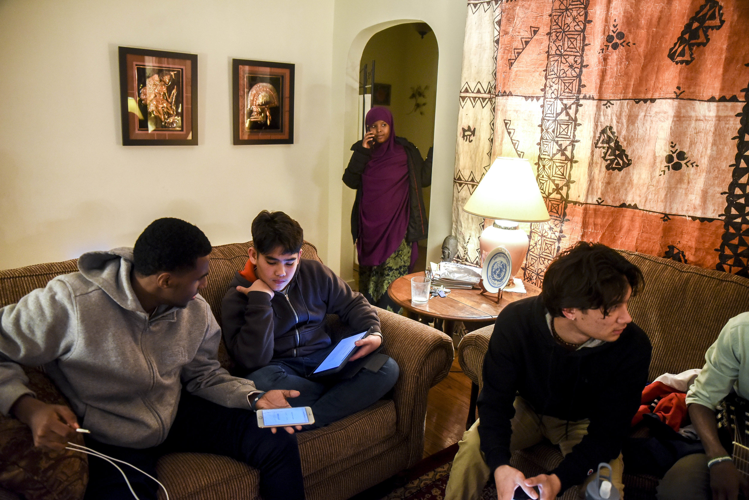  Hamdi Kosar answers a phone call while her friends plays games on their phones Feb. 14, 2019 in Willmar. 