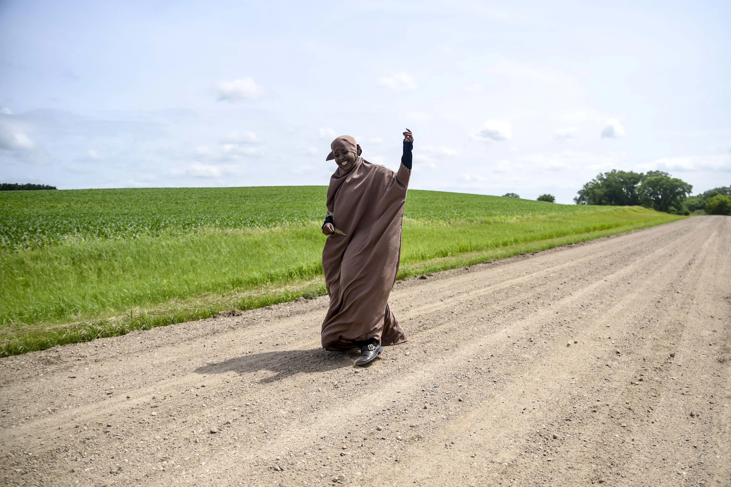 Kosar laughs while walking down a country road in Colfax Township June 29, 2019.