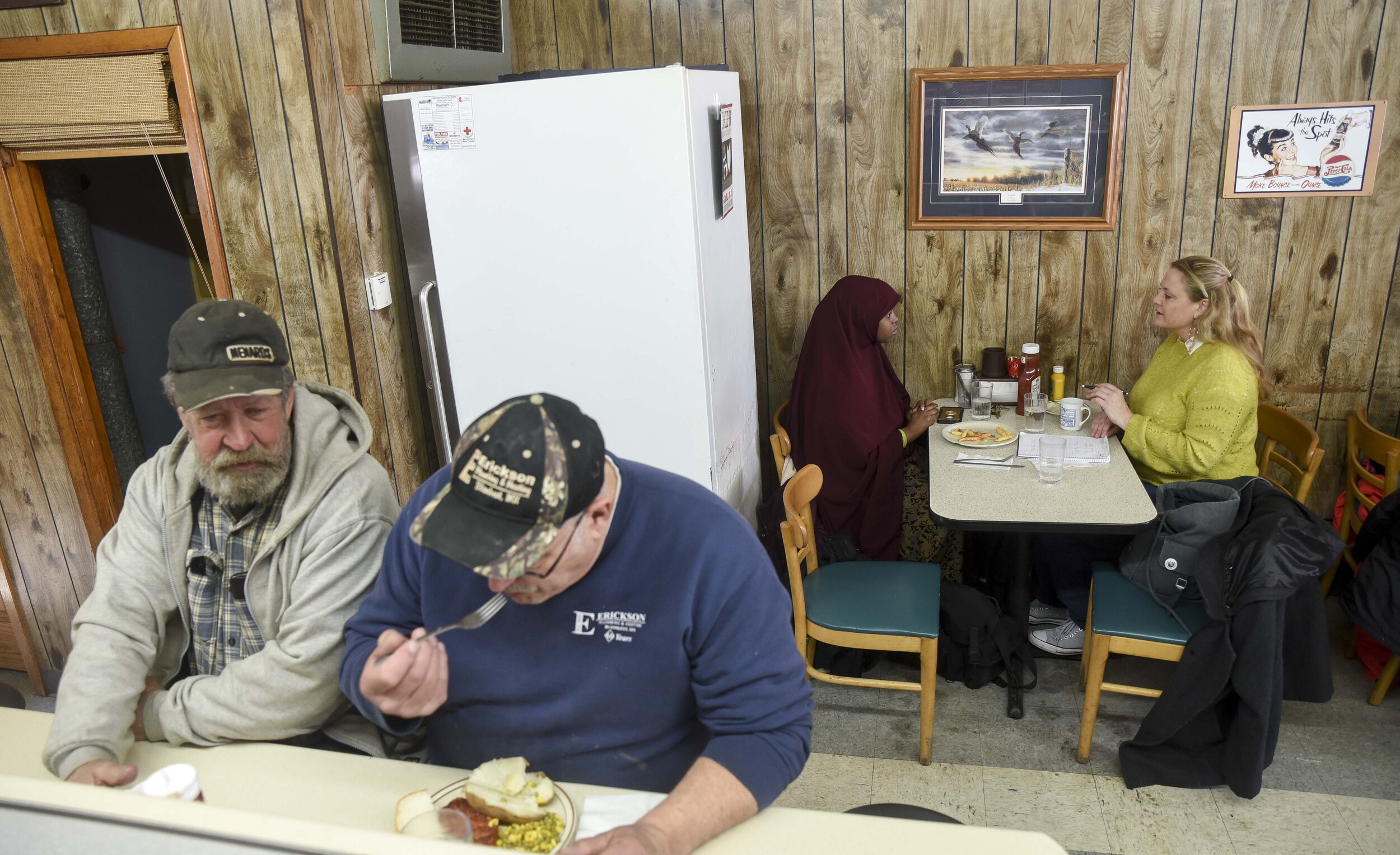  Kosar eats with Jessica Rohloff, a friend and colleague, March 9, 2019 at Frieda’s Cafe, a popular spot for railroad workers and longtime Willmar residents. Jessica and Hamdi work to heal tensions between Somali refugees and other Willmar area resid