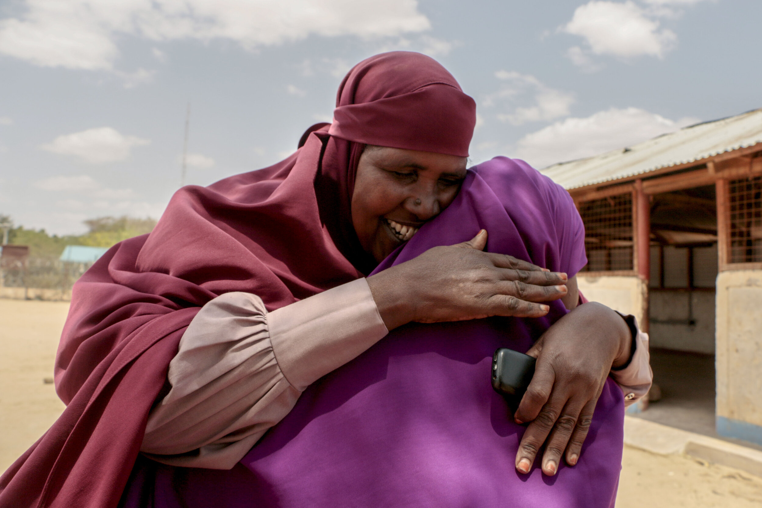  Ruqia Osman embraces Hamdi Kosar Aug. 19, 2019 at the Dagahaley Refugee Camp in Dadaab, Kenya. Osman has lived in the camp for around 30 years and went through the resettlement process with Kosar’s family nearly a decade ago. Her daughter, who she h
