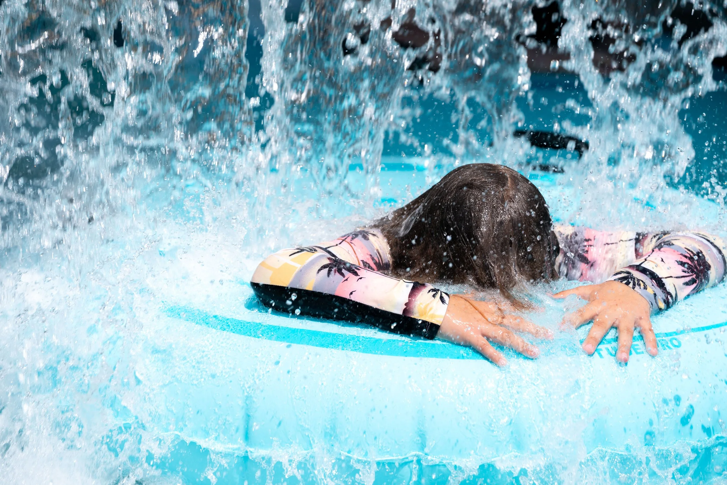  A tuber gets splashed by water in the lazy river Tuesday, June 14, 2022 at Bunker Beach Water Park in Coon Rapids, Minn.      