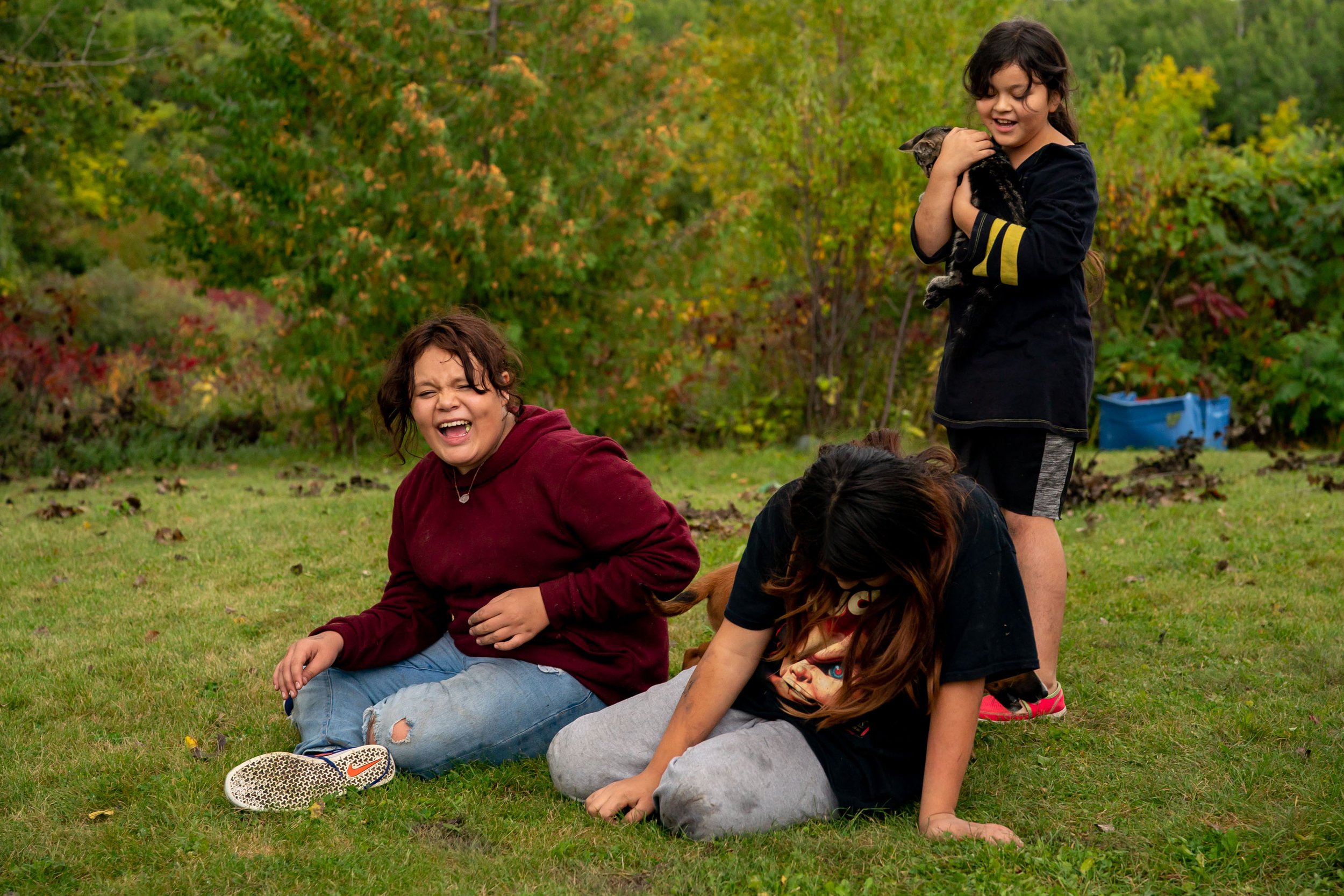  Maryjane Shimek, 12, left, shares a laugh with her family members Trishell Thompson, 11, and Aleecia Azure, 9, near their home in the White Earth community Sept. 24, 2022 on the White Earth Reservation. Maryjane is undergoing a berry fast, which is 