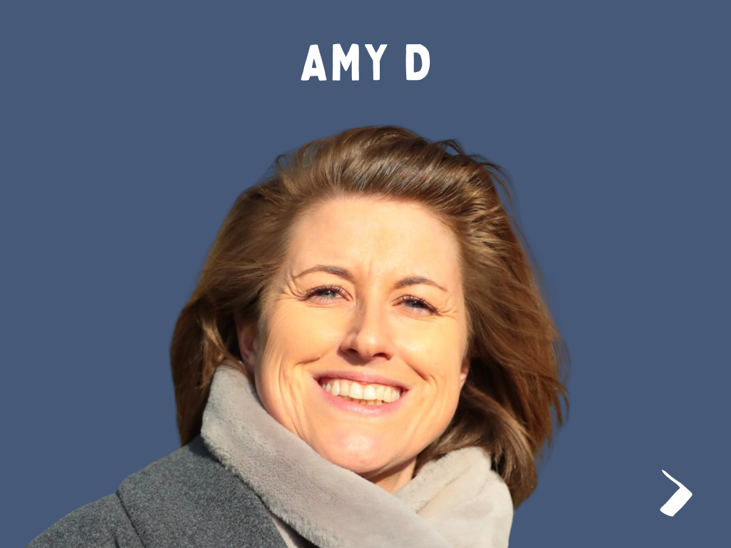 Close-up of a smiling woman with shoulder-length brown hair, wearing a gray scarf, against a solid blue background. Text above her reads 'AMY D'.