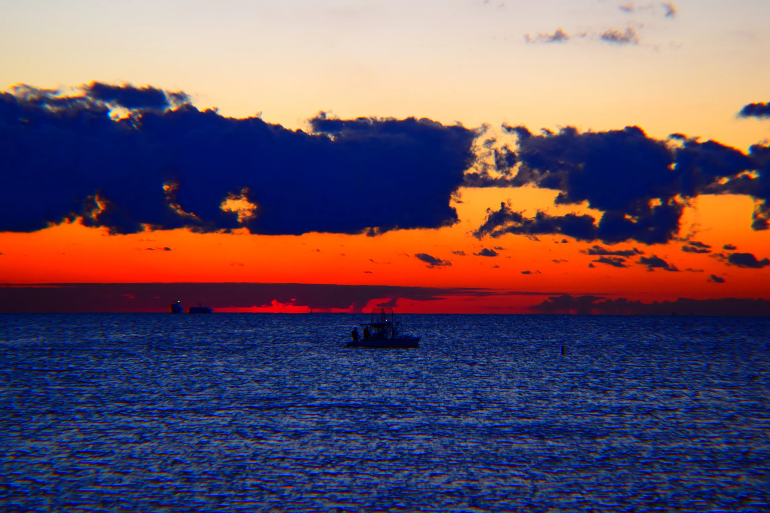  Sun yawning and stretching prior to rising at Miami Beach. 