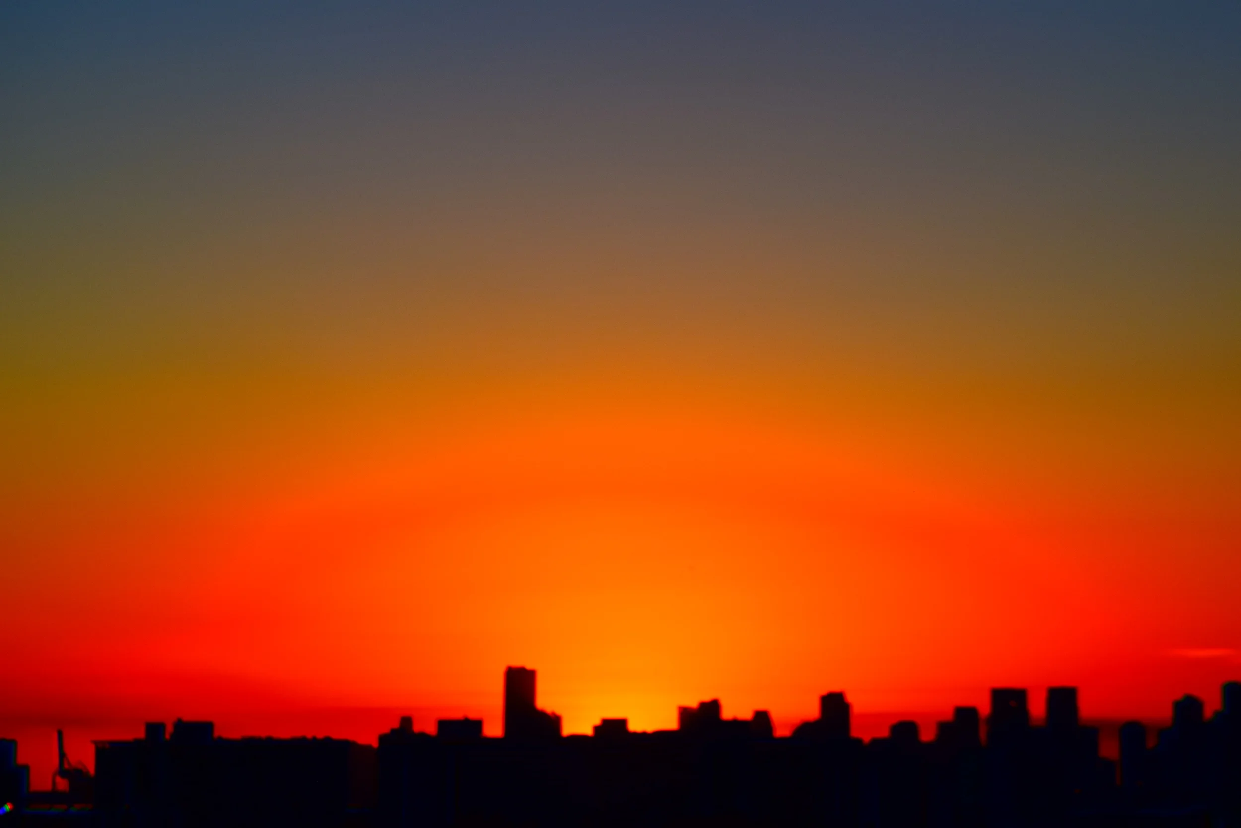  Lingering orange blush of sunset over Miami. 