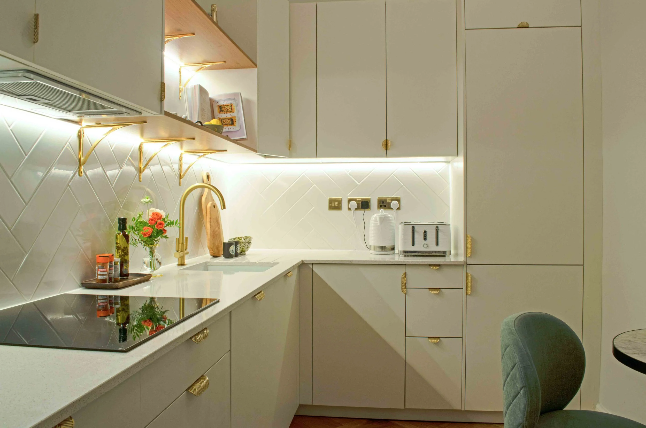 Modern Scandinavian white kitchen with herrinbone wall tiles and brass fixtures  ©Detail Movement Interiors