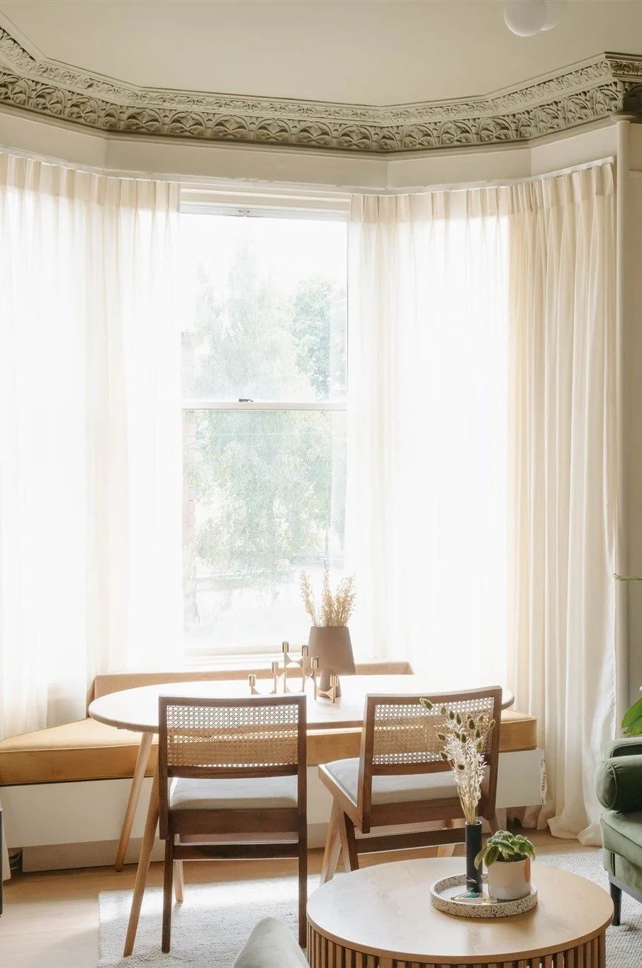 Bespoke living room dining bench in window bay of an Edinburgh apartment