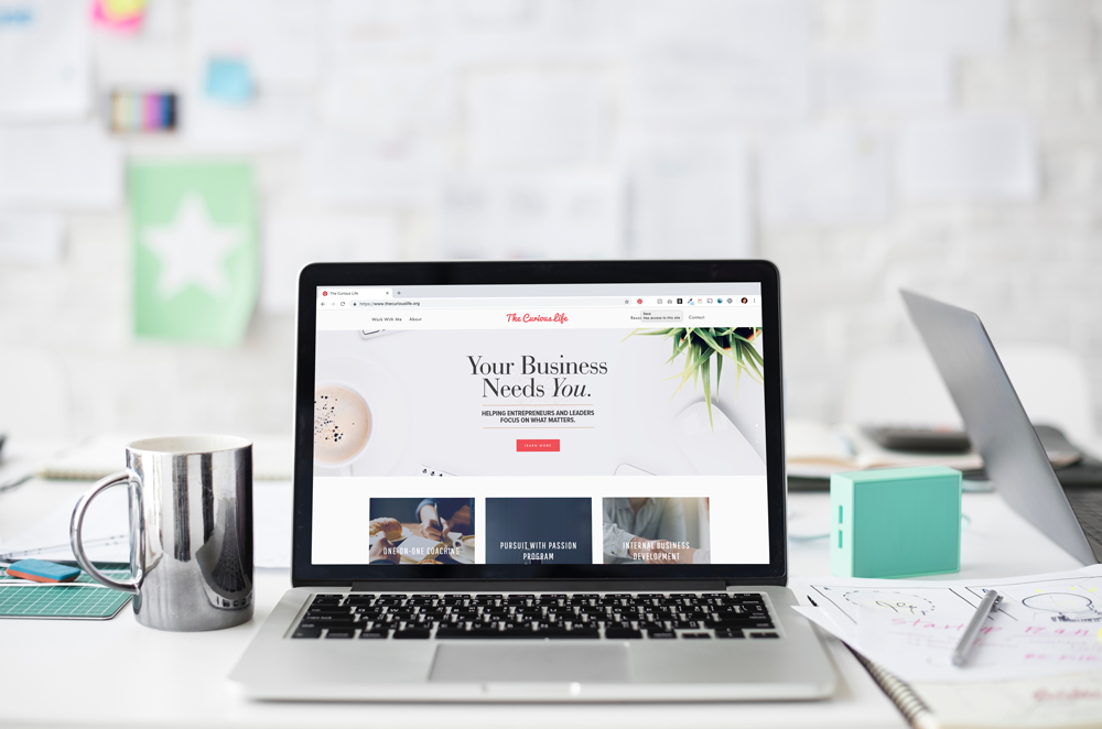 Working on my laptop at my local workspace. Squarespace website design and branding coaching for entrepreneurs.