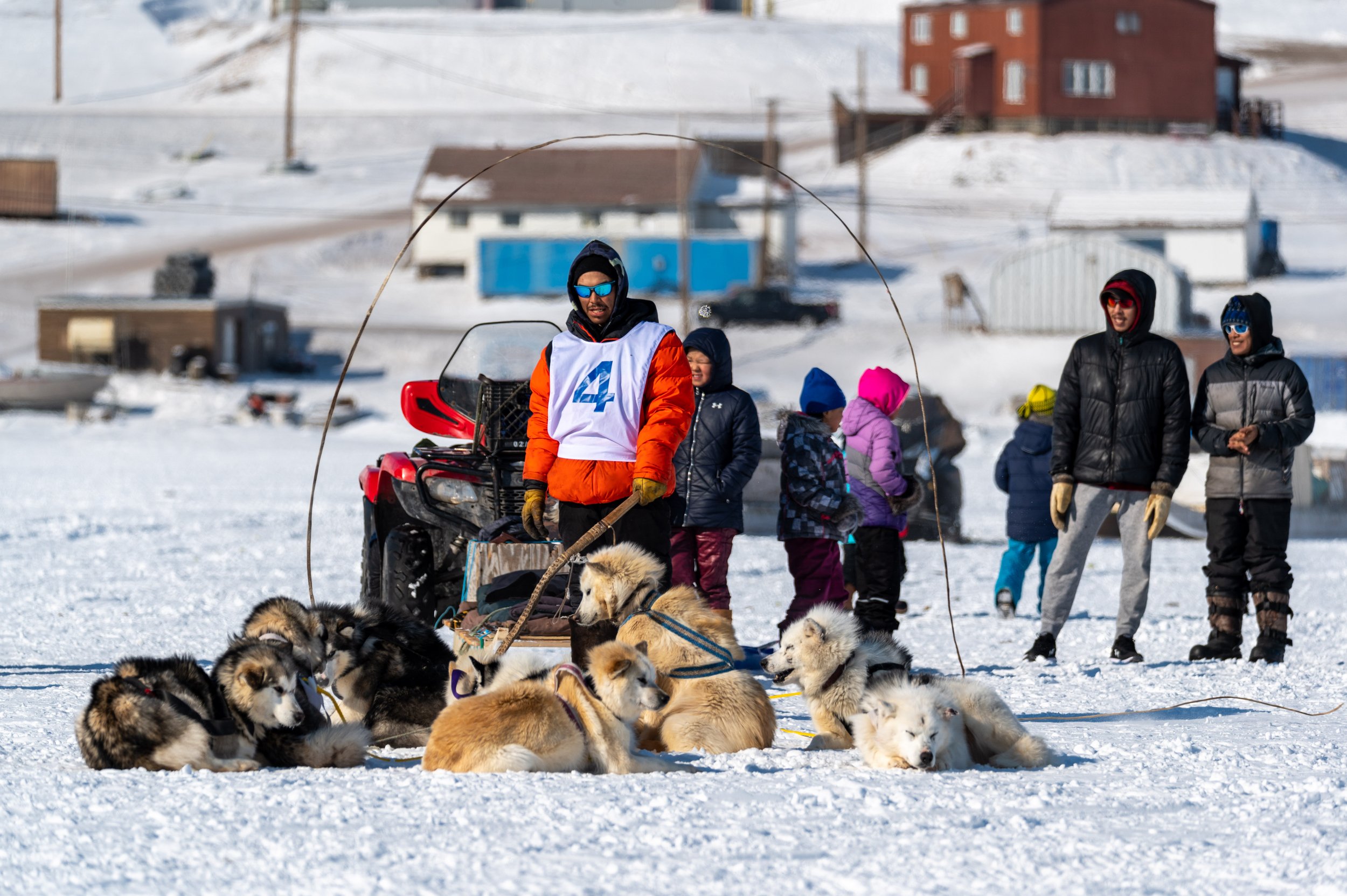  Jeremy Koonoo, a musher from Arctic Bay, Nunavut, readies his dog team prior to the start of the Nunavut Quest in Arctic Bay, on Monday, April 18, 2022. Taken for The Canadian Press 